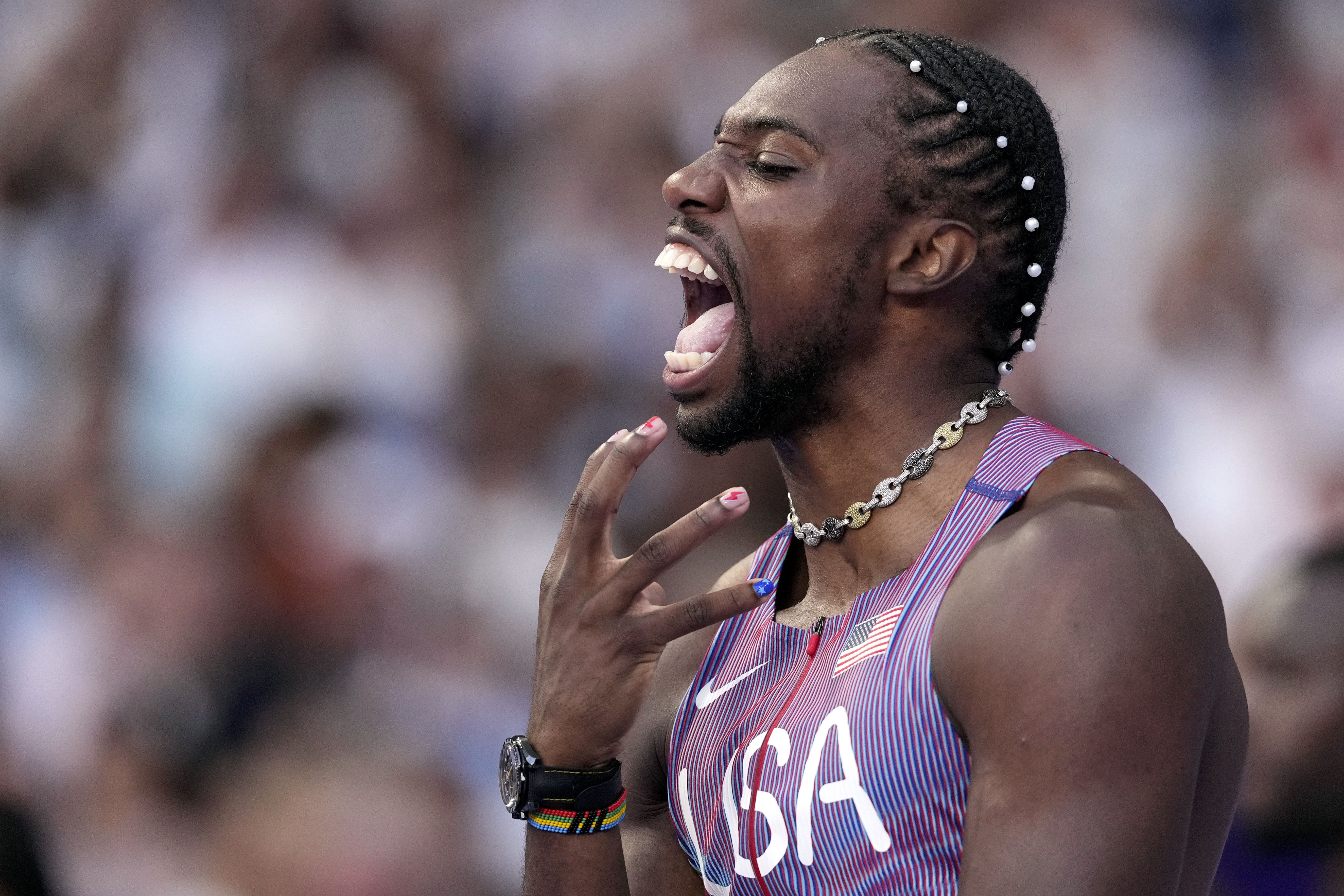 Noah Lyles, of the United States, reacts ahead of his men's 100-meters semifinal at the 2024 Summer Olympics, Sunday, Aug. 4, 2024, in Saint-Denis, France. 