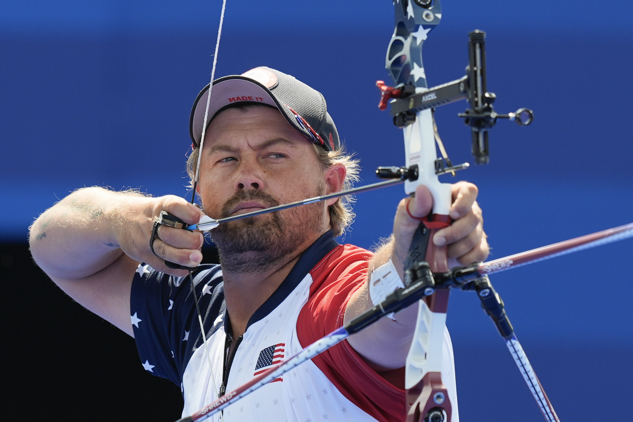 Brady Ellison of the United States lines up a shot in the men's individual archery final against South Korea's Kim Woo-jin, at the 2024 Summer Olympics, Sunday, Aug. 4, 2024, in Paris, France. 