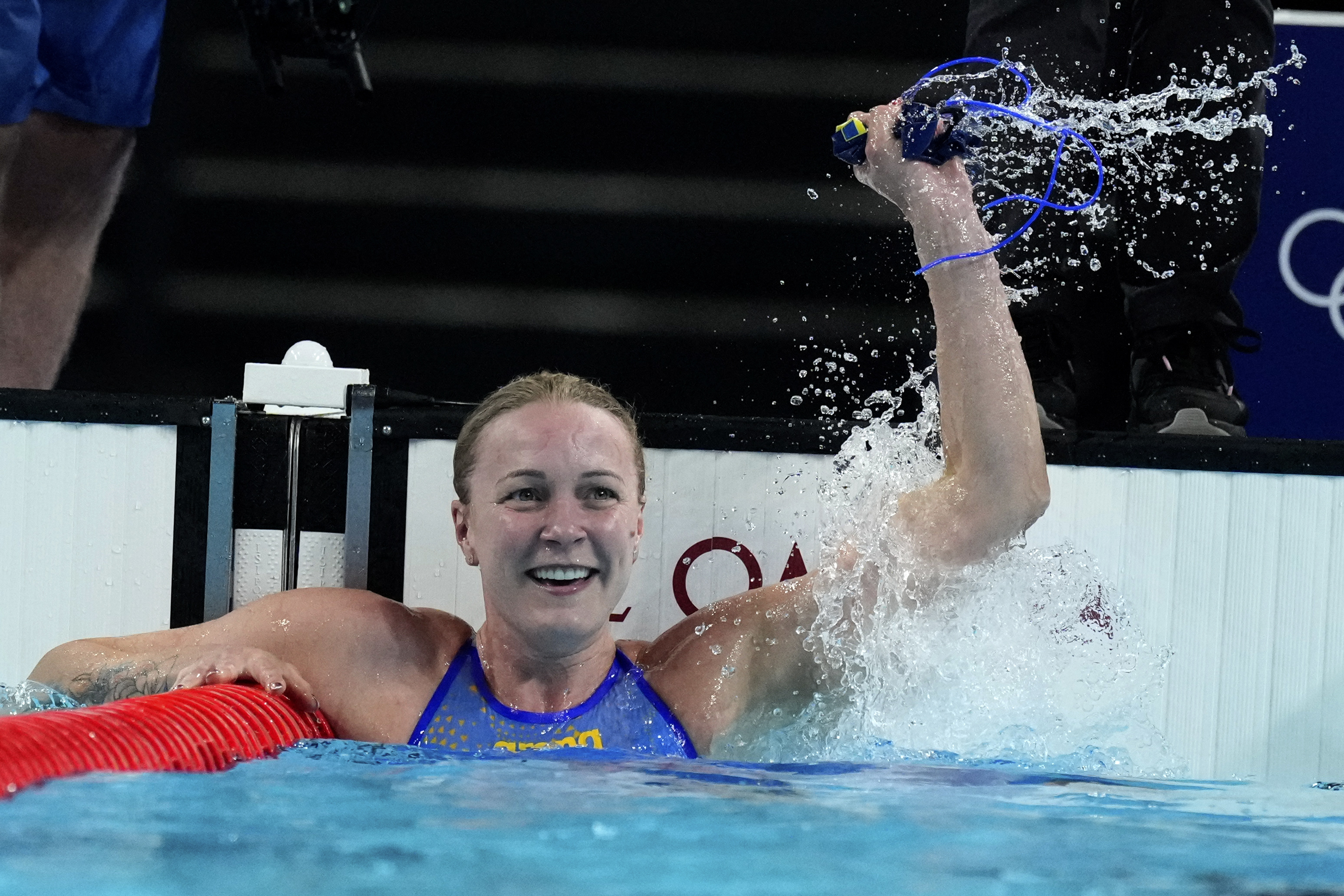 Sweden's Sarah Sjoestroem celebrates after winning the gold medal in the women's 50-meter freestyle final at the Summer Olympics in Nanterre, France, Sunday, Aug. 4, 2024.