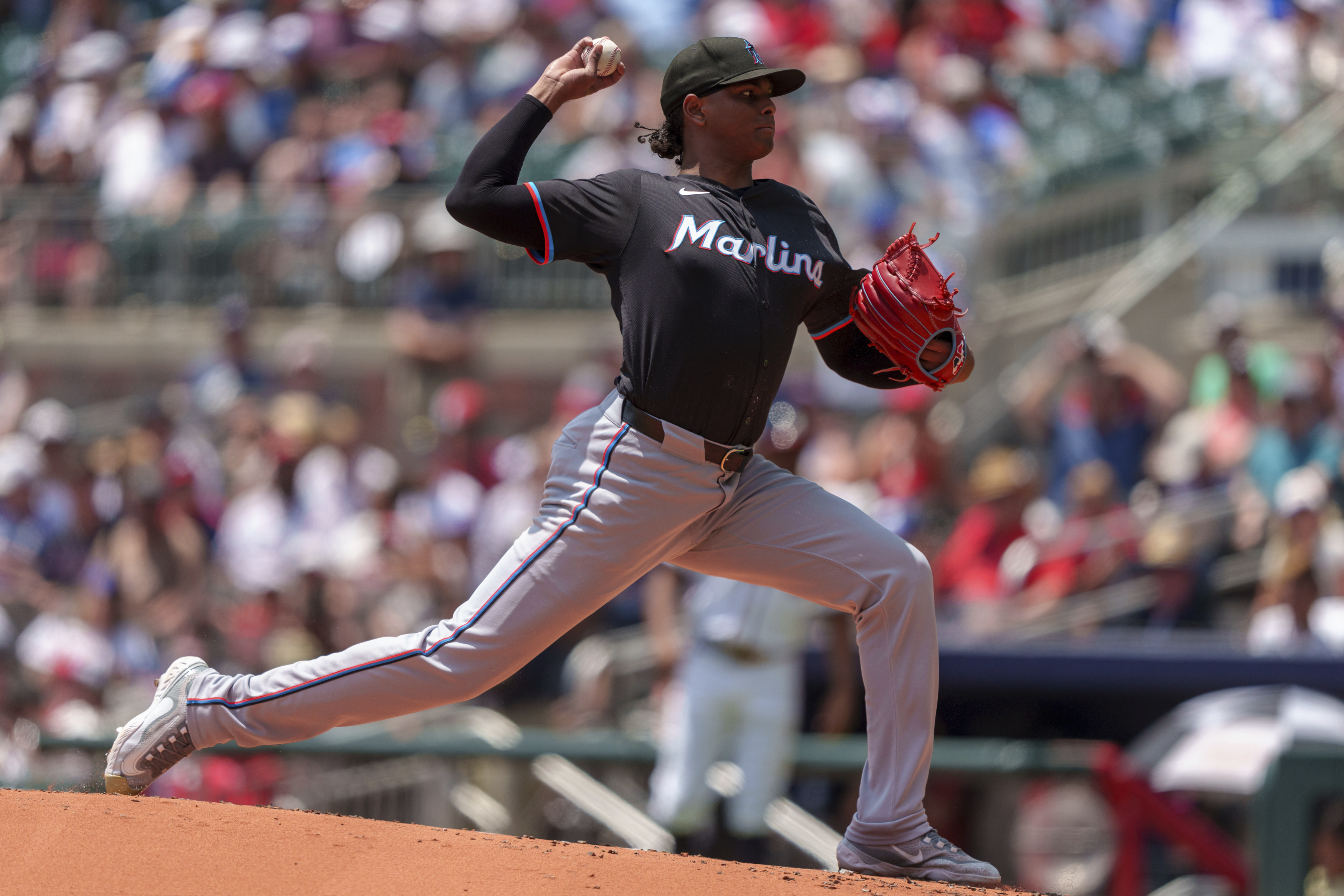 Miami Marlins pitcher Edward Cabrera throws in the first inning of a baseball game against the Atlanta Braves, Sunday, Aug. 4, 2024, in Atlanta. 