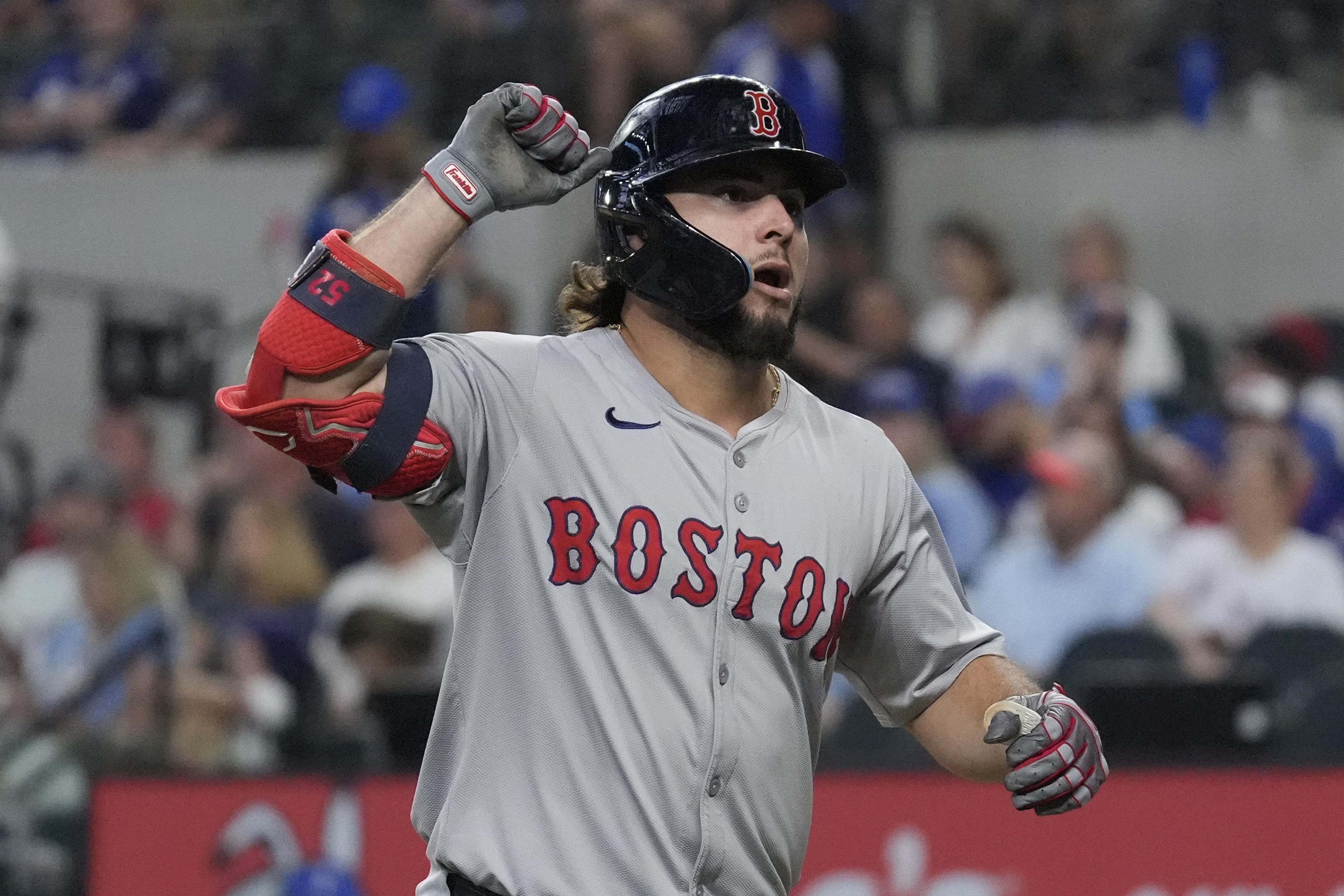Boston Red Sox's Wilyer Abreu celebrates after hitting a home run during the fourth inning of a baseball game against the Texas Rangers in Arlington, Texas, Sunday, Aug. 4, 2024. 