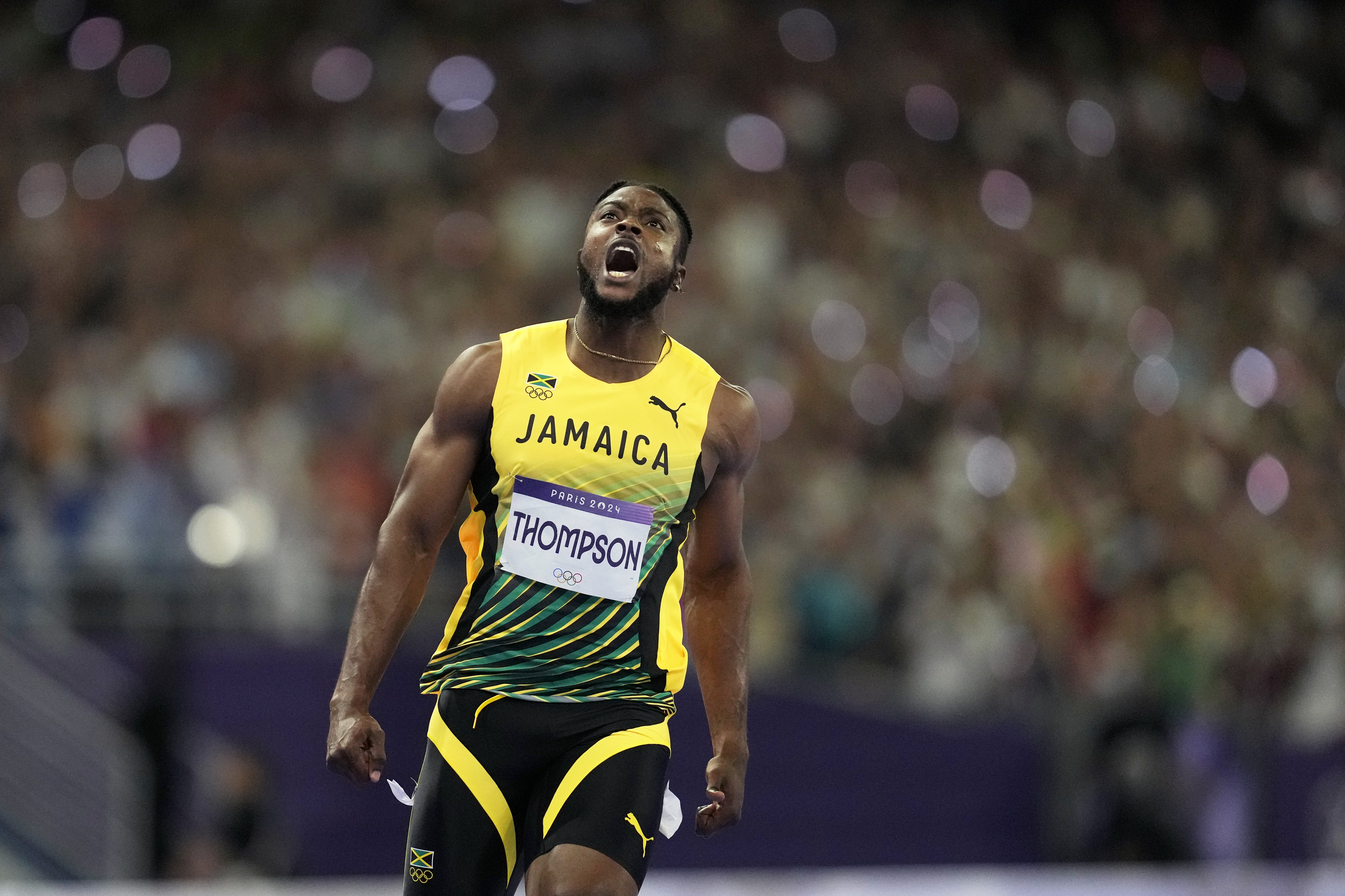 Kishane Thompson, of Jamaica, reacts after crossing the finish line in the men's 100 meters final at the 2024 Summer Olympics, Sunday, Aug. 4, 2024, in Saint-Denis, France. Noah Lyles, of the United States, won, and Thompson was second. 