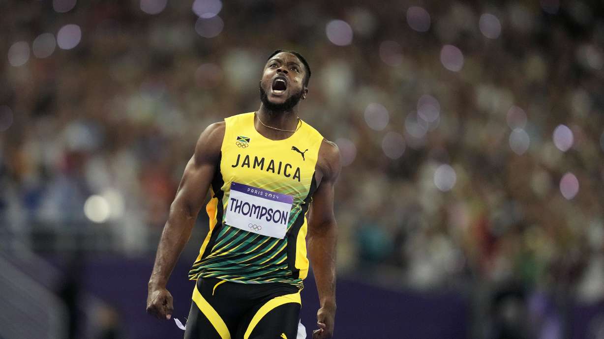 Kishane Thompson, of Jamaica, reacts after crossing the finish line in the men's 100 meters final at the 2024 Summer Olympics, Sunday, Aug. 4, 2024, in Saint-Denis, France. Noah Lyles, of the United States, won, and Thompson was second.