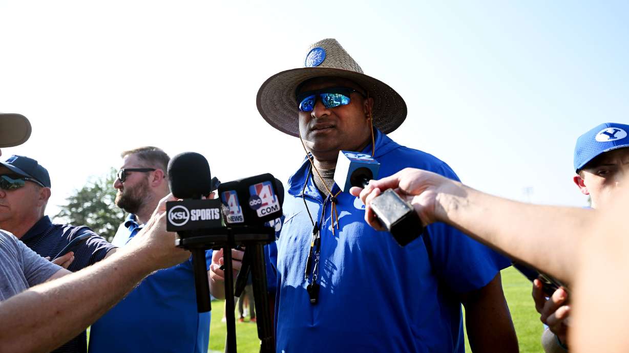 BYU head coach Kalani Sitake talks with media members after the Cougars held their first fall football practice in Provo on Wednesday, July 31, 2024.