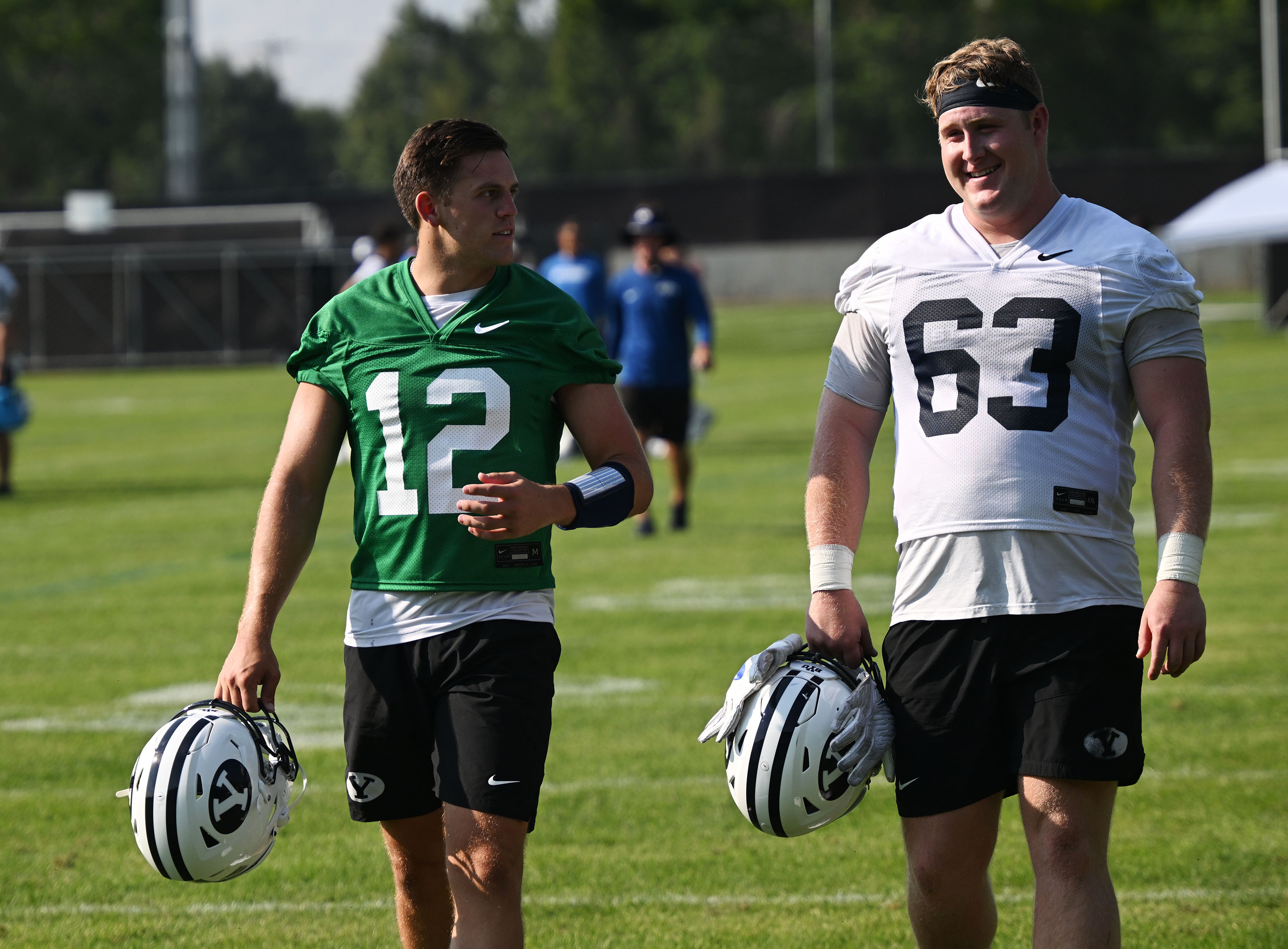 Quarterback Jake Retzlaff and offensive lineman Bruce Mitchell as they walk off the field as BYU holds their first fall football practice in Provo on Wednesday, July 31, 2024.