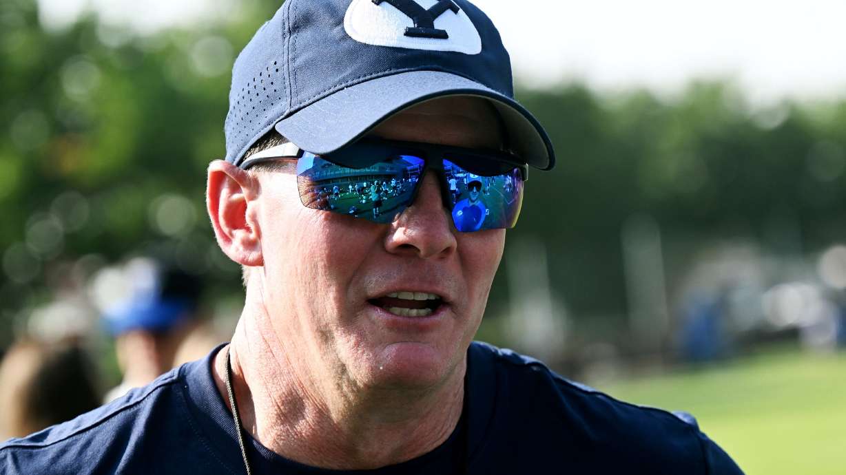 BYU defensive coordinator Jay Hill talks with offensive coordinator Aaron Roderick after BYU held their first fall football practice in Provo on Wednesday, July 31, 2024.