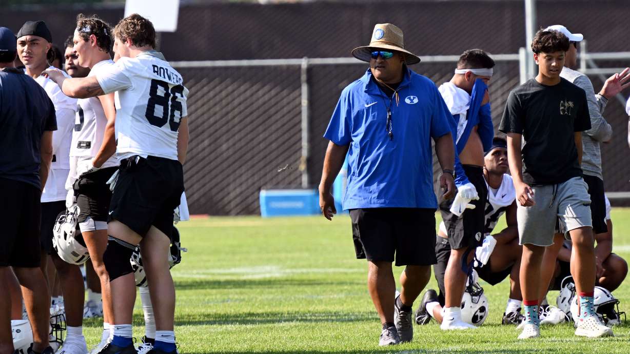 BYU head coach Kalani Sitake walks amongst his players as the Cougars hold their first fall football practice in Provo on Wednesday, July 31, 2024.