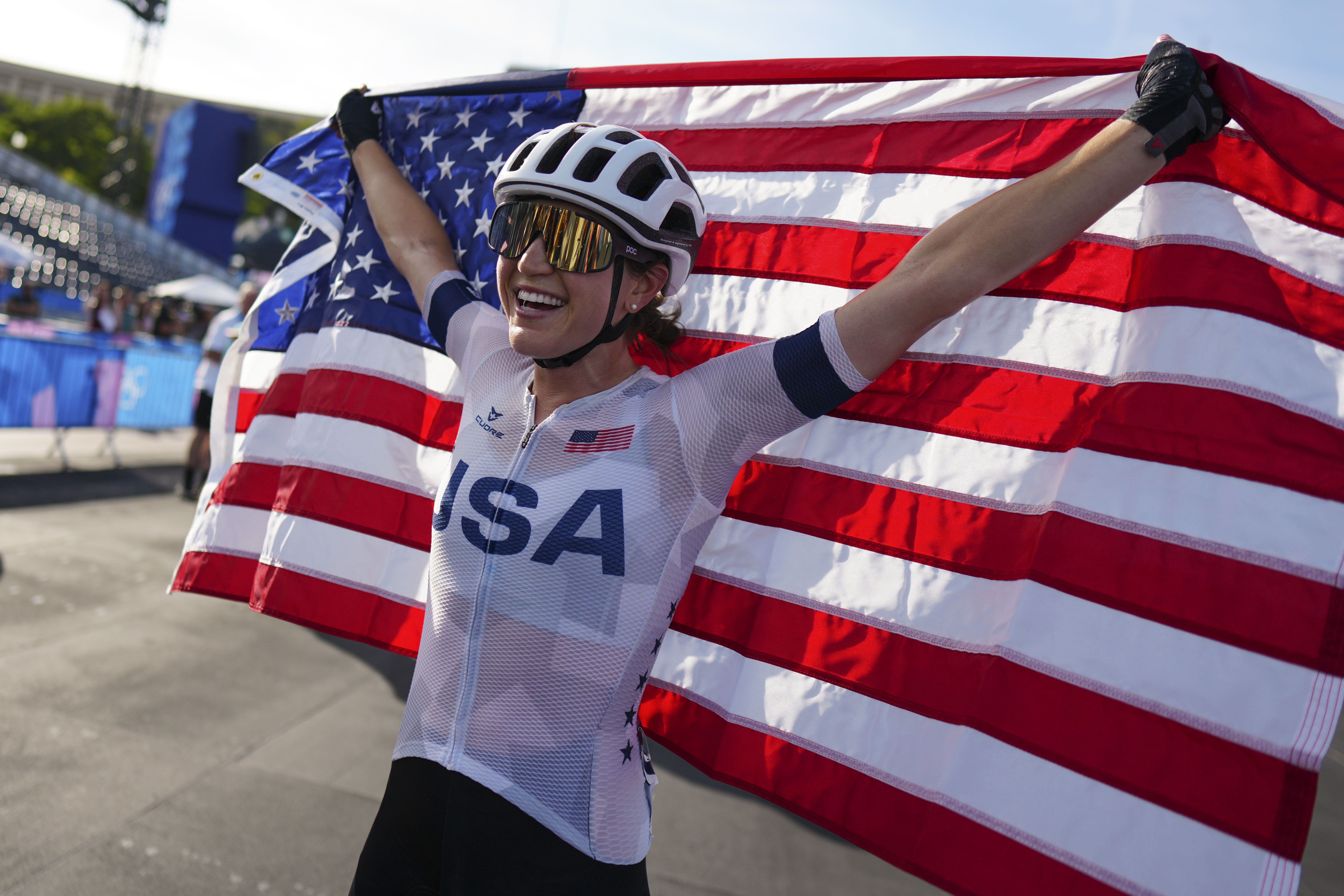 Kristen Faulkner, of the United States, celebrates winning the women's road cycling event, at the 2024 Summer Olympics, Sunday, Aug. 4, 2024, in Paris, France. 