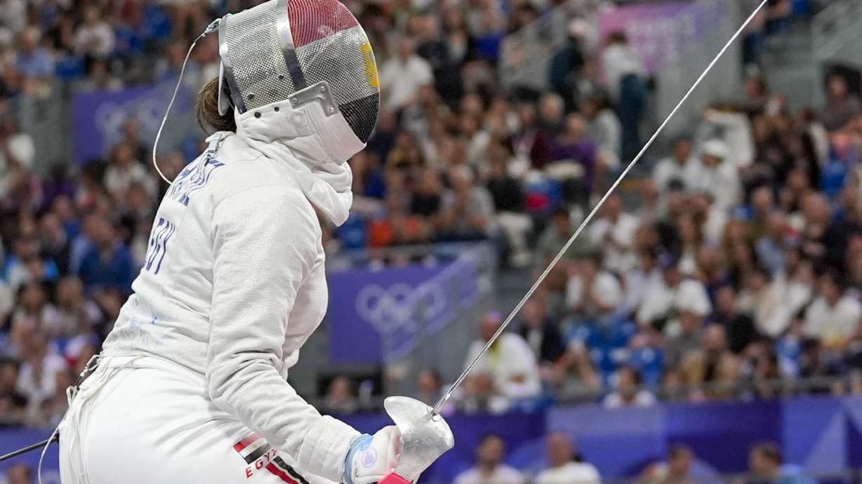 Egypt's Nada Hafez competes with United States' Elizabeth Tartakovsky in the women's individual Sabre round of 32 competition during the 2024 Summer Olympics at the Grand Palais, Monday, July 29, 2024, in Paris, France.