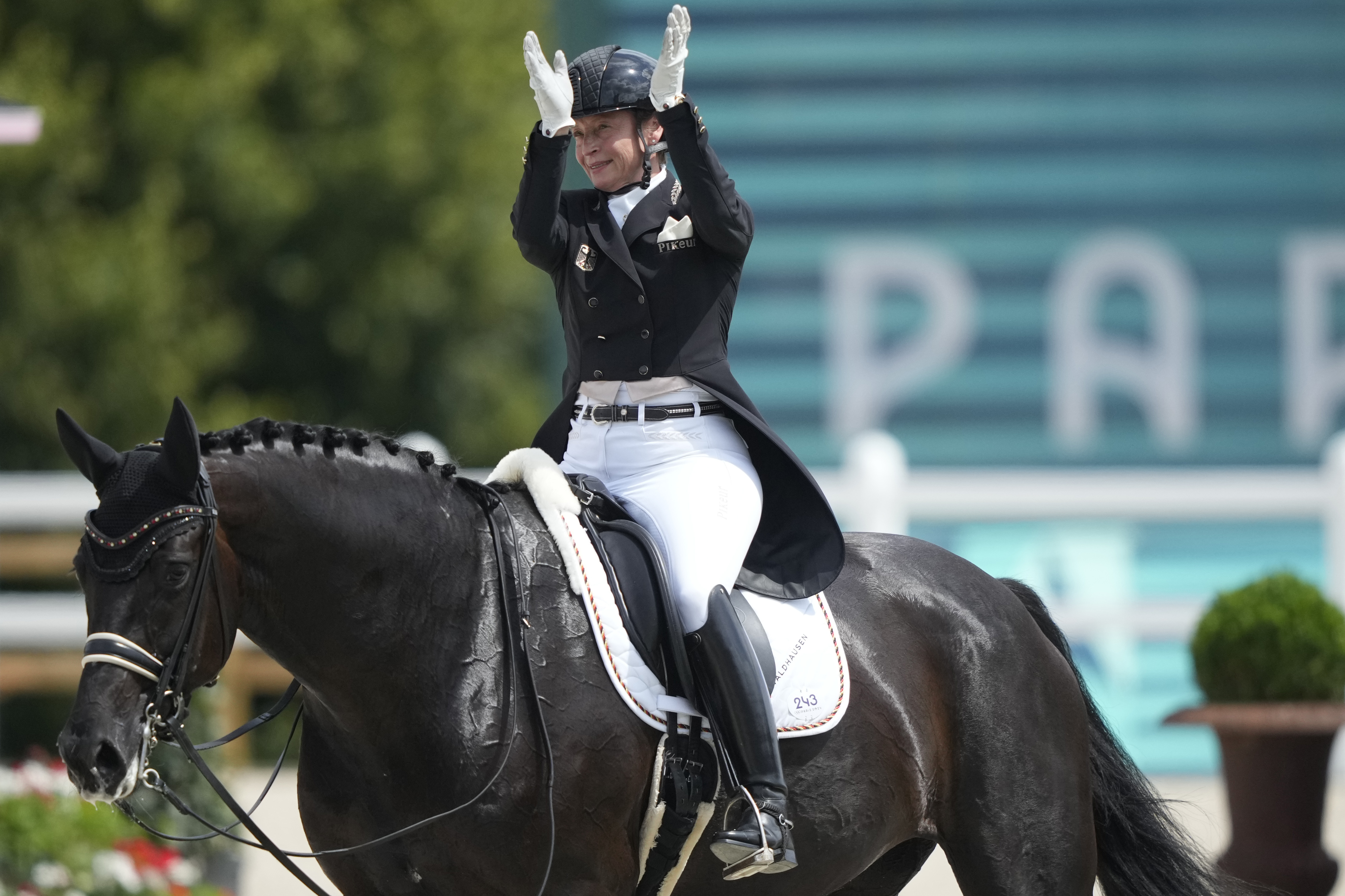 Germany's Isabell Werth riding Wendy applauds during the dressage team Grand Prix final at the 2024 Summer Olympics, Saturday, Aug. 3, 2024, in Versailles, France. 