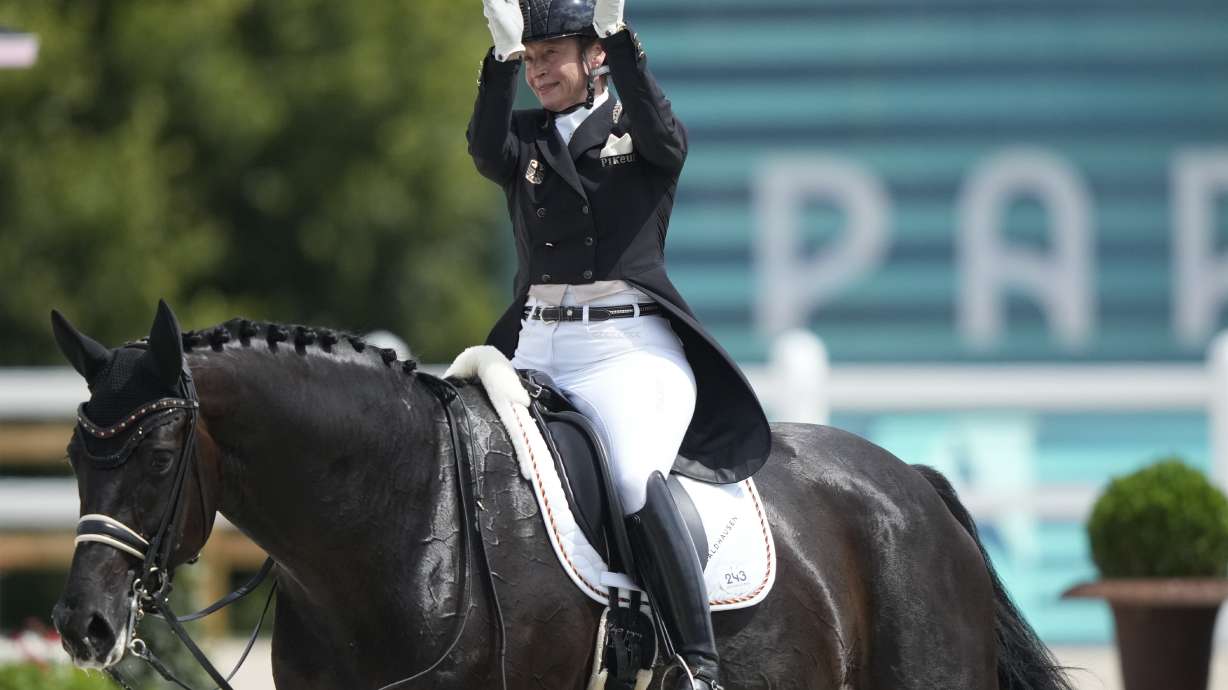 Germany's Isabell Werth riding Wendy applauds during the dressage team Grand Prix final at the 2024 Summer Olympics, Saturday, Aug. 3, 2024, in Versailles, France.