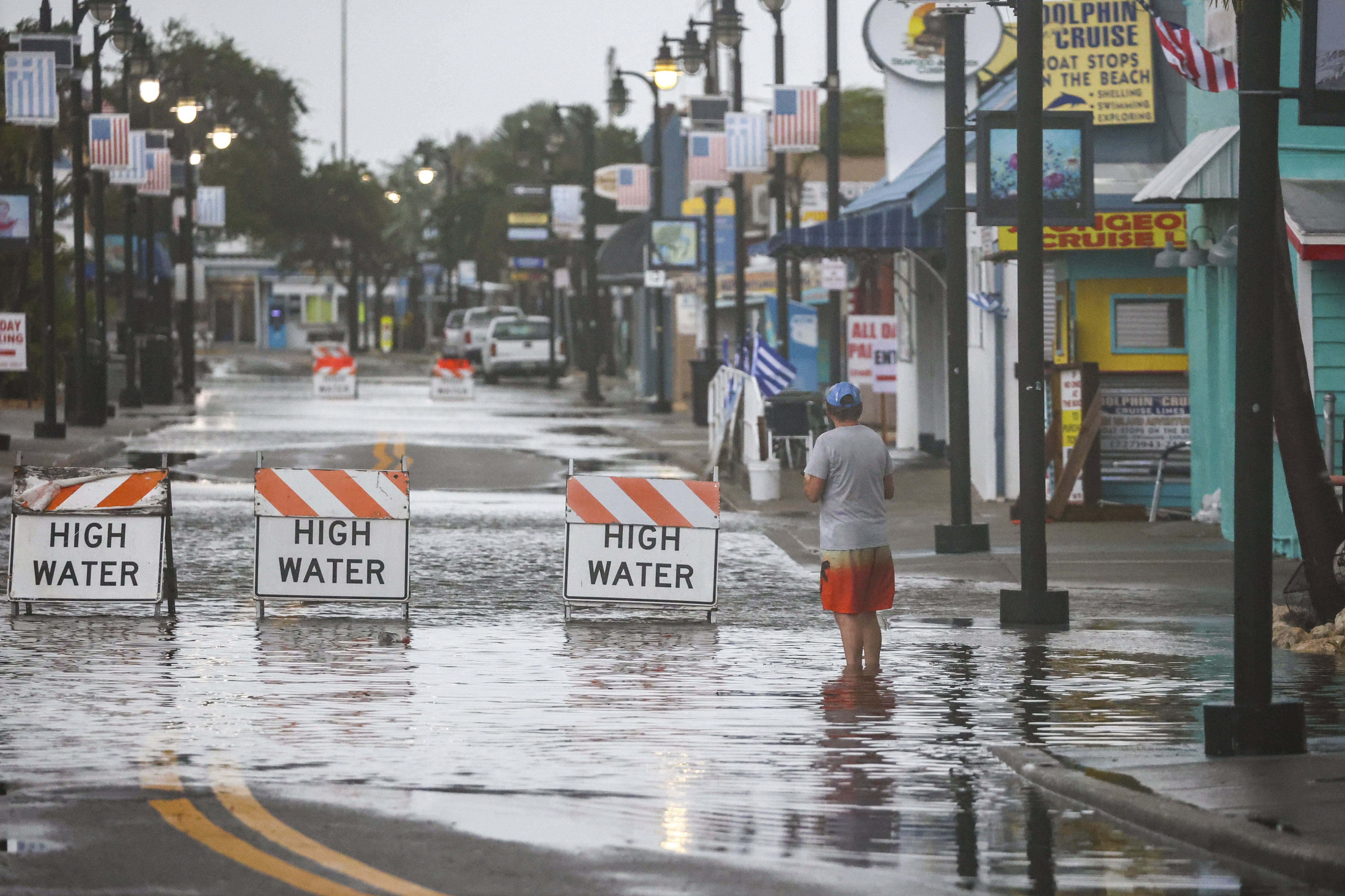 Flood water blocks a section of Dodecanese Blvd at the Tarpon Springs Sponge Docks, Monday morning, in Tarpon Springs, Fla., as Hurricane Debby passes the Tampa Bay area offshore.