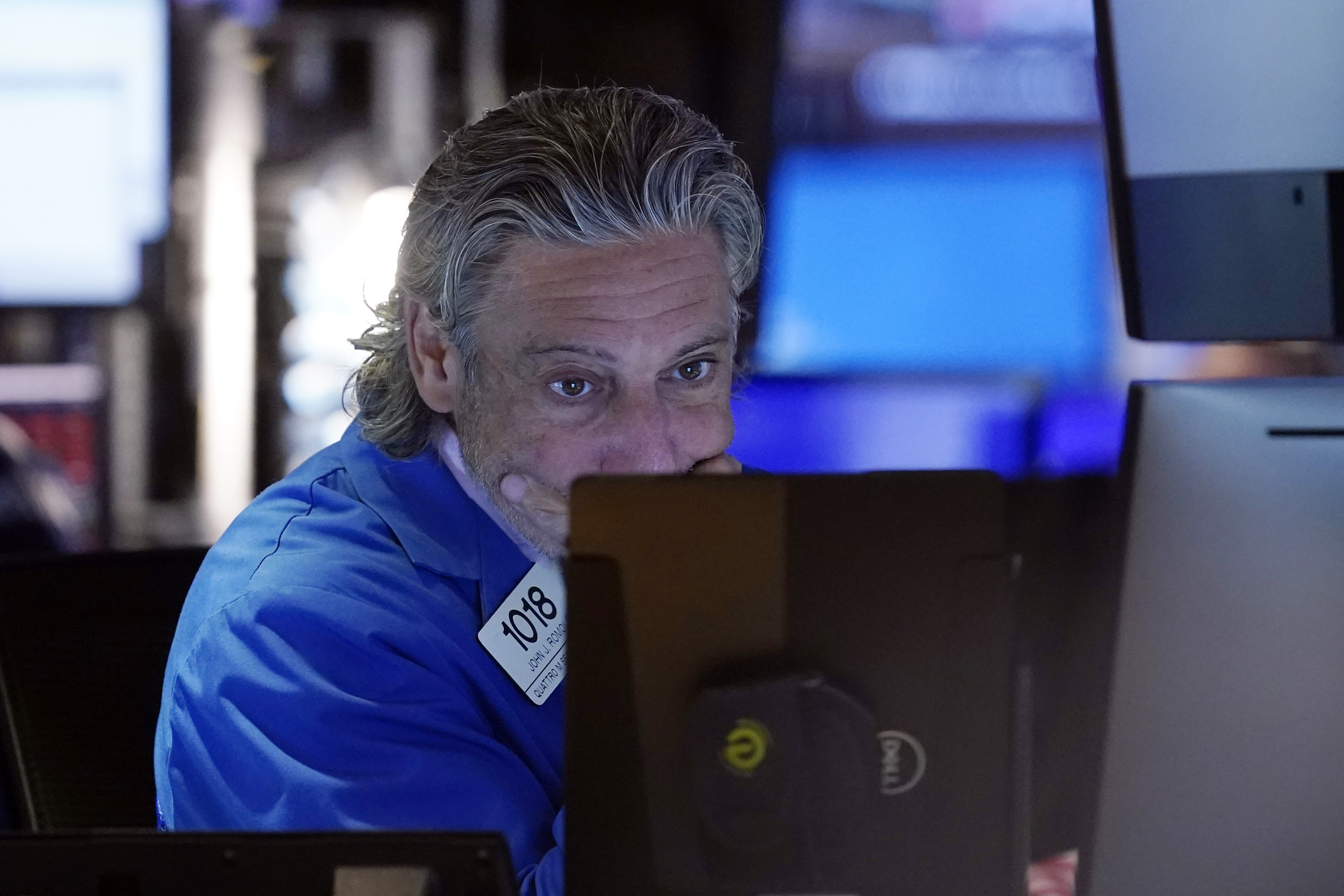 Trader John Romolo works on the floor of the New York Stock Exchange, Friday. Nearly everything on Wall Street is tumbling Monday.