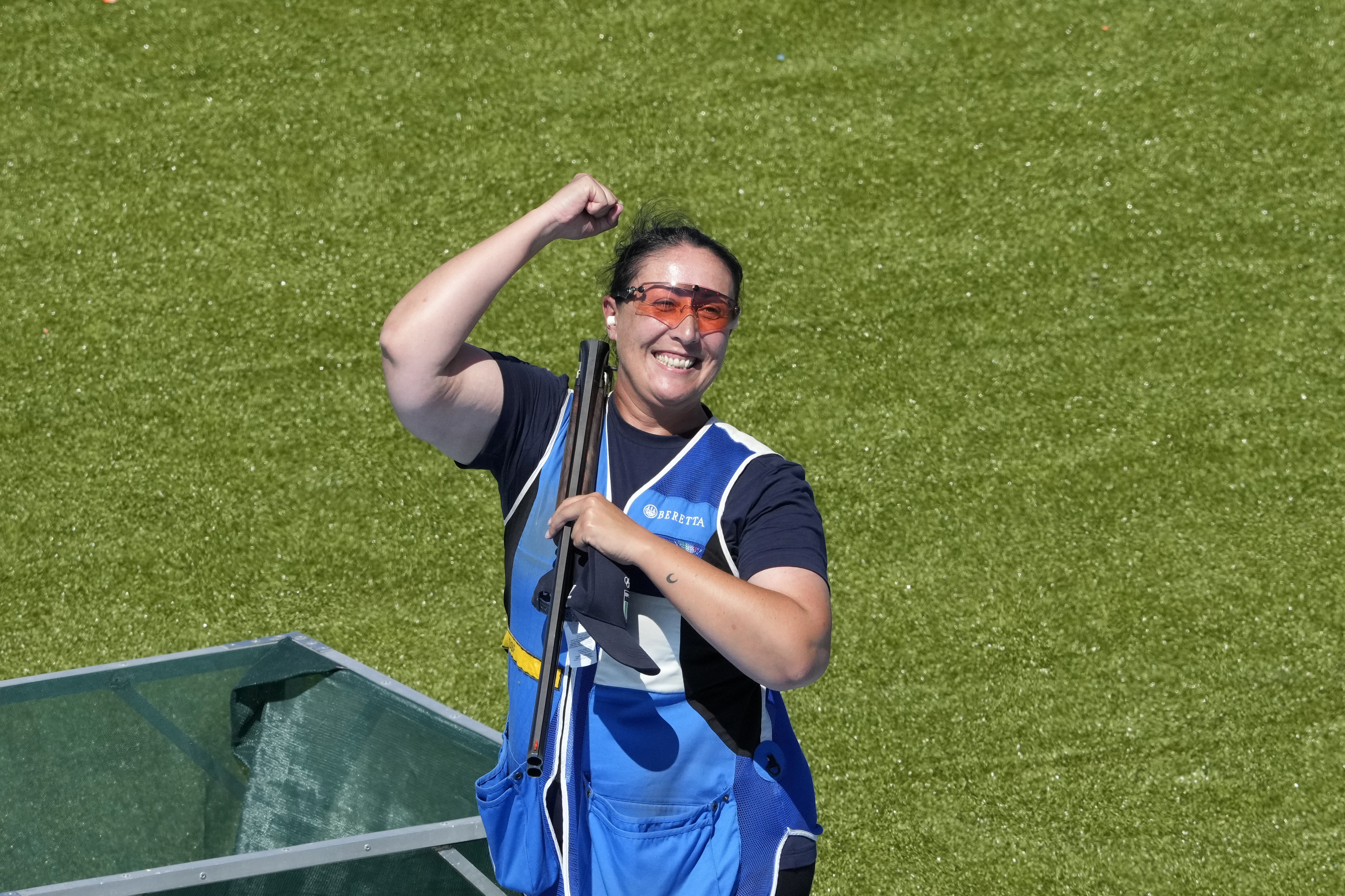 Italy's Diana Bacosi celebrates after winning the gold medal with teammate Gabriele Rossetti in the Skeet mixed team final at the 2024 Summer Olympics, Monday, Aug. 5, 2024, in Chateauroux, France. 