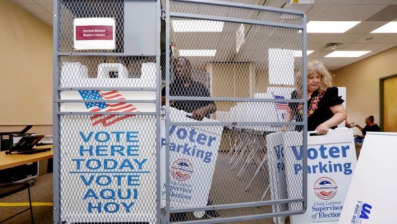 Poll workers with the Hillsborough County Supervisor of Elections Office work at the Seffner-Mango Branch Library in Seffner, Fla. on Aug. 2. Some states have not adopted electoral reforms intended to avoid post-election chaos.