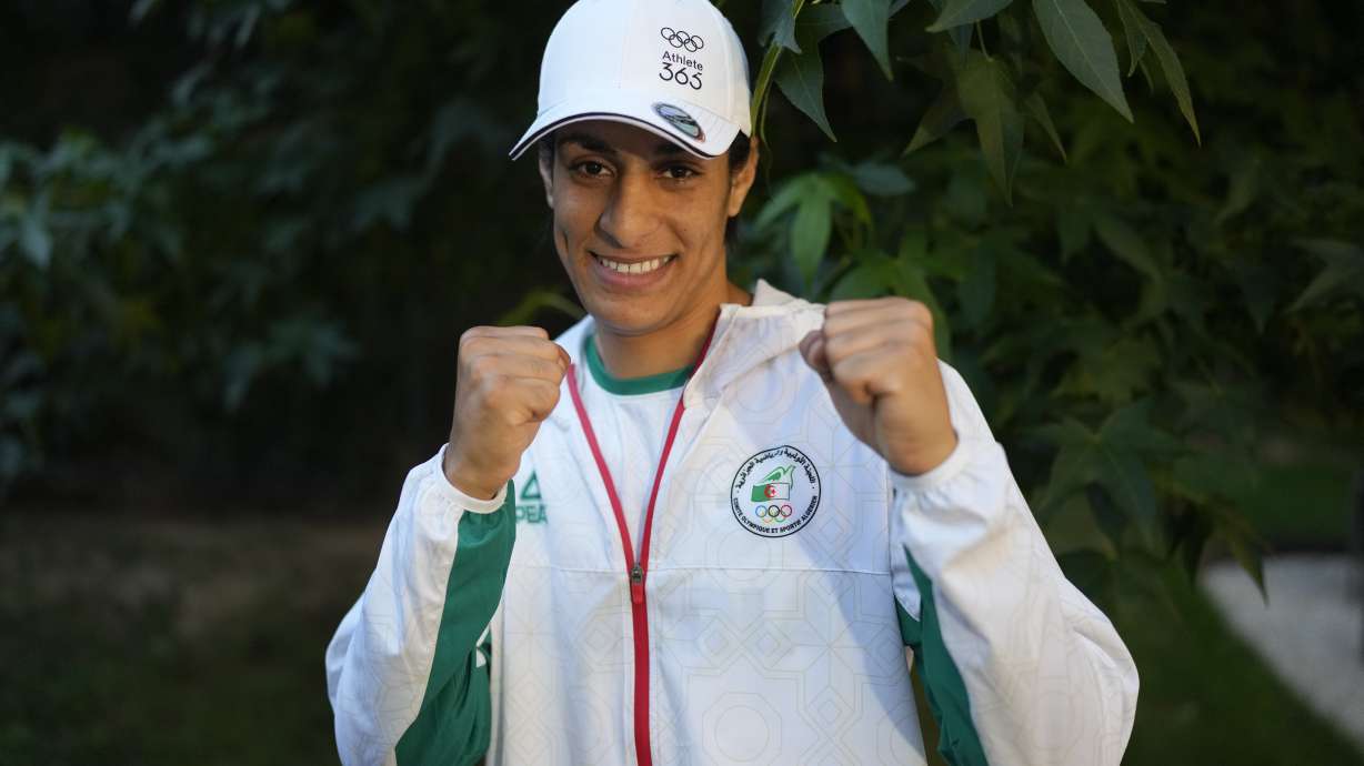 Algerian boxer Imane Khelif poses for a photo after an interview with SNTV at the 2024 Summer Olympics, Sunday, Aug. 4, 2024, in Paris, France.