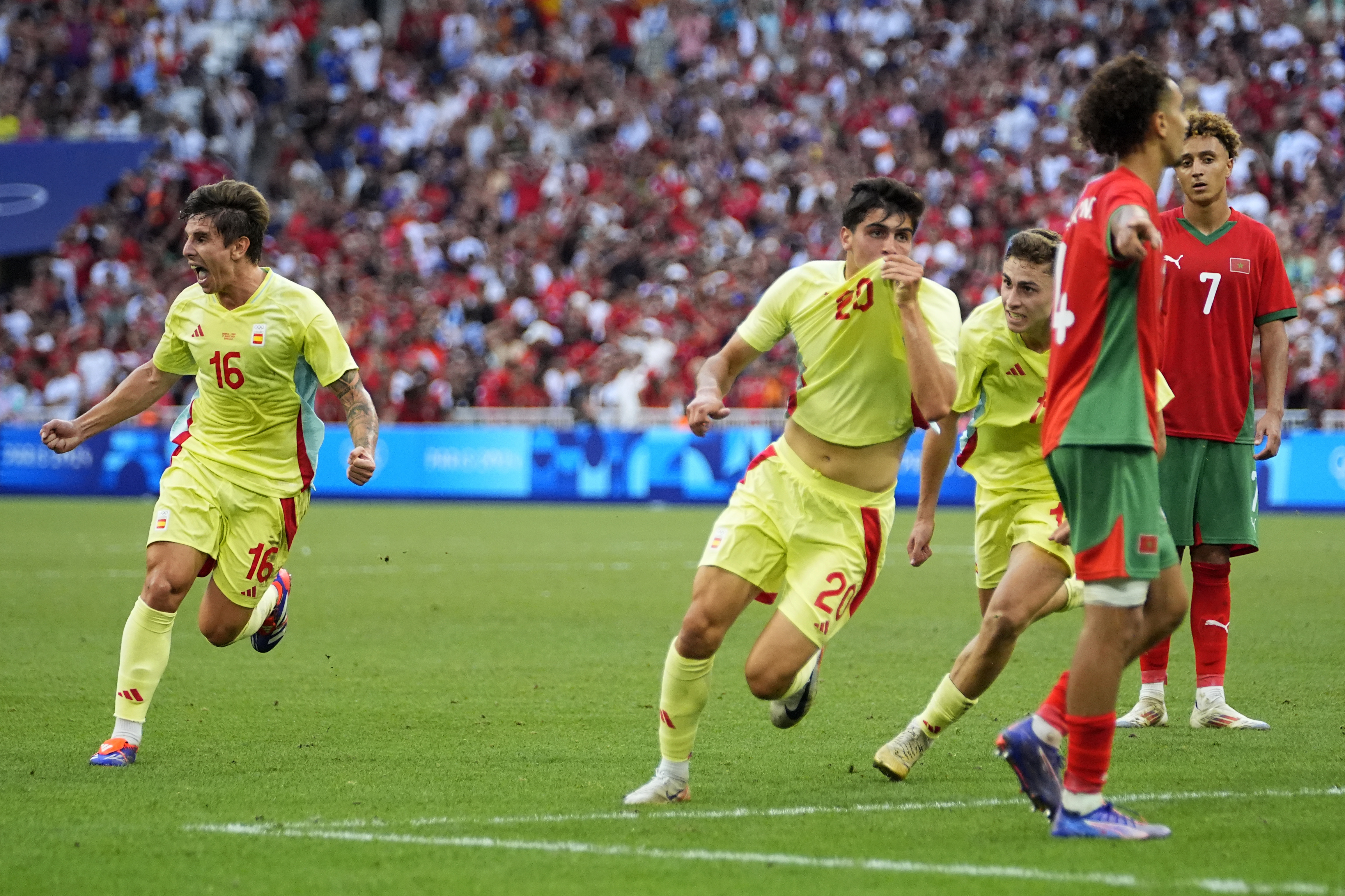 Spain's Juanlu Sanchez celebrates scoring his side's second goal during a men's semifinal soccer match between Morocco and Spain at the 2024 Summer Olympics, Monday, Aug. 5, 2024, at Marseille Stadium in Marseille, France.
