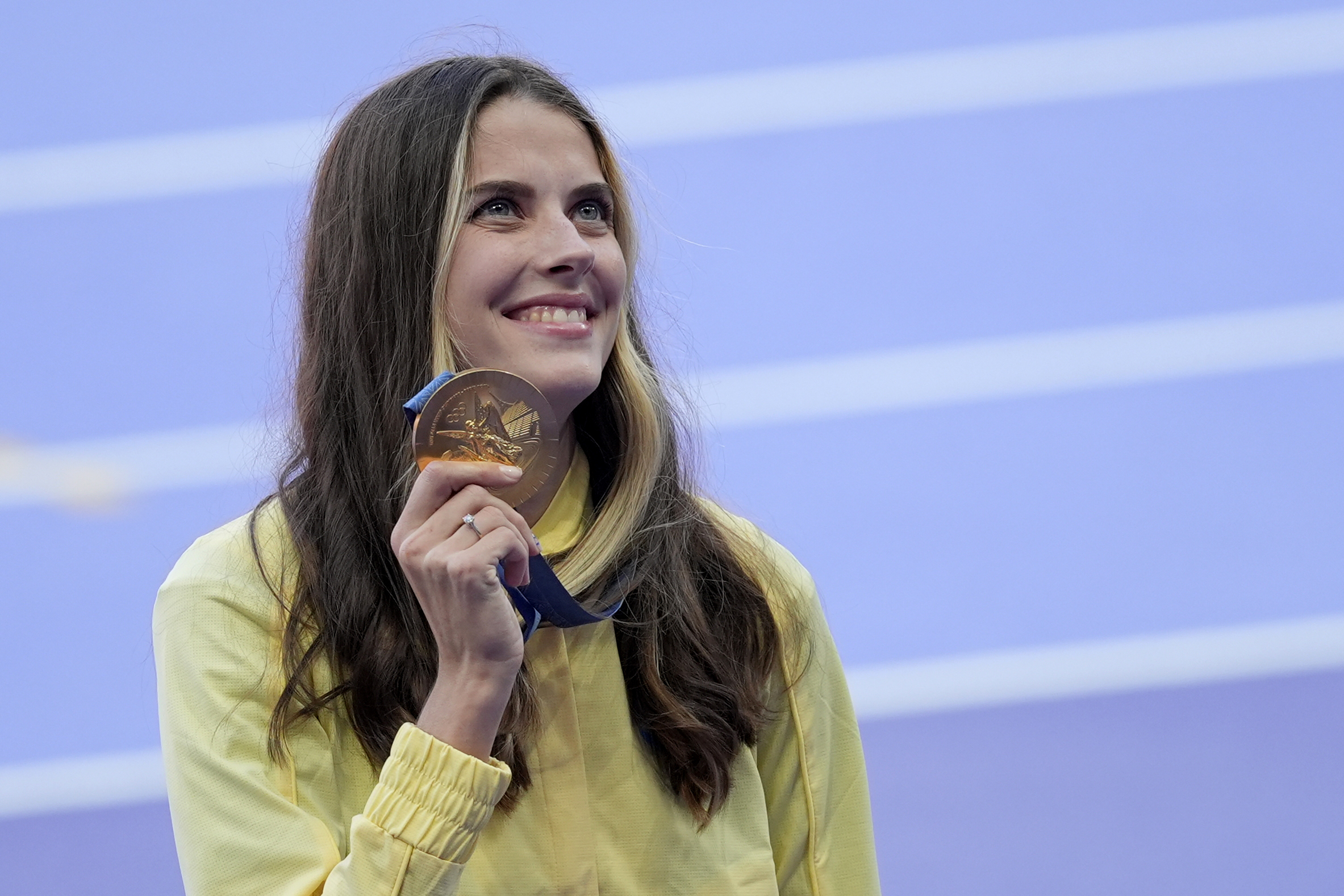 Women's high jump gold medalist Yaroslava Mahuchikh, of Ukraine, poses for a photo on the podium at the 2024 Summer Olympics, Monday, Aug. 5, 2024, in Saint-Denis, France. 