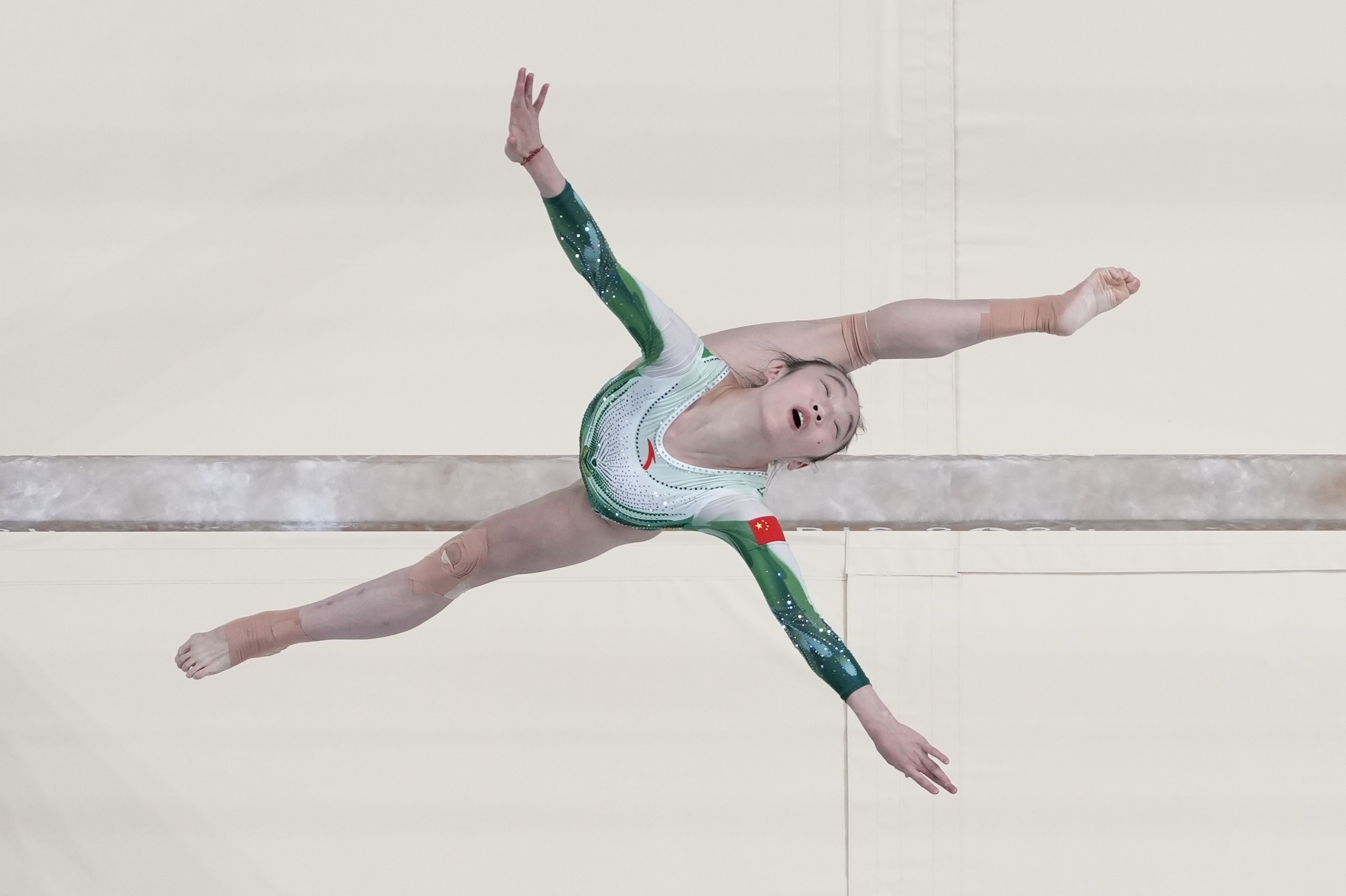 Zhou Yaqin, of China, performs on the beam during the women's artistic gymnastics individual balance beam finals in Bercy Arena at the 2024 Summer Olympics, Monday, Aug. 5, 2024, in Paris, France.