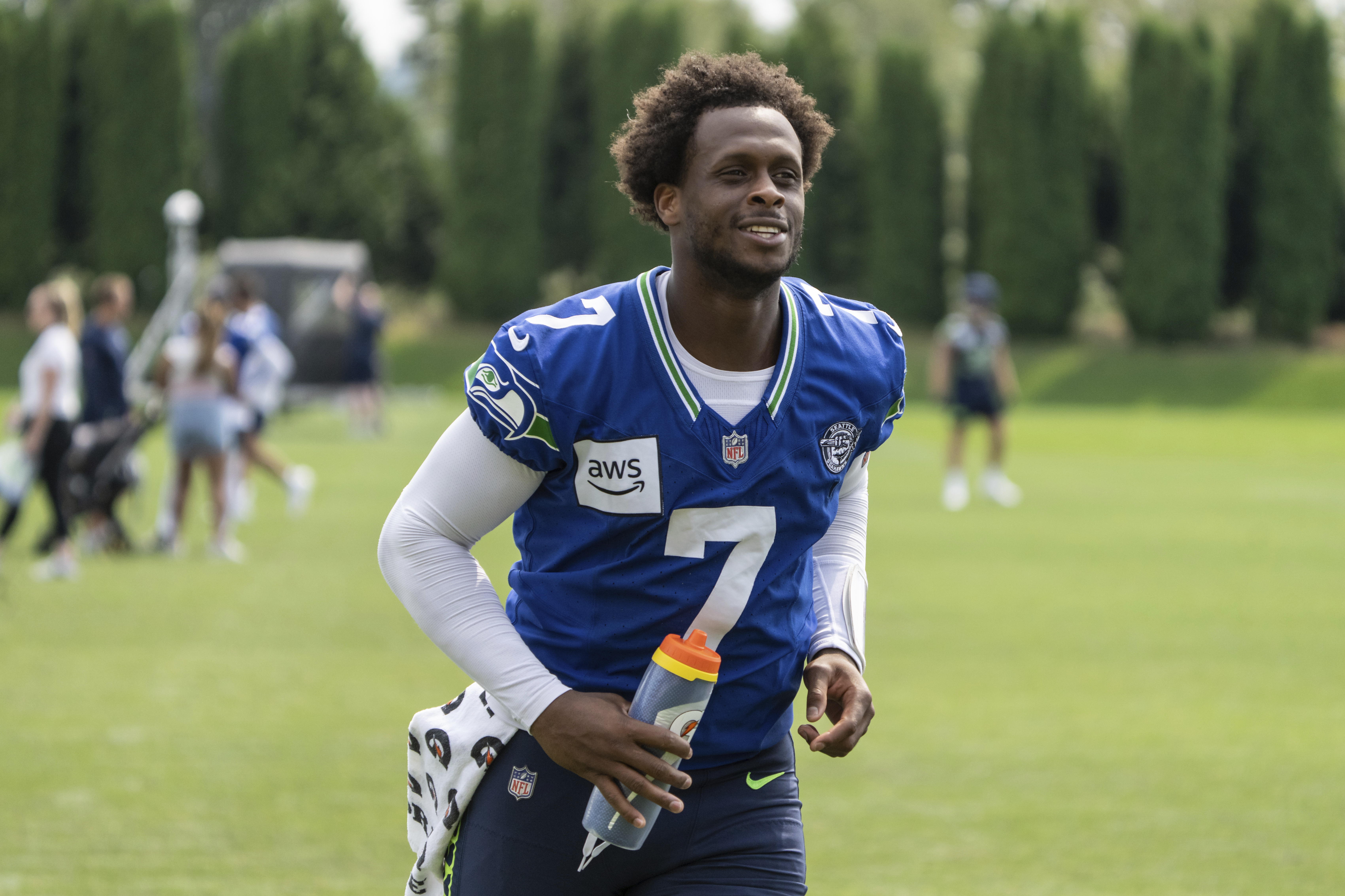 Seattle Seahawks quarterback Geno Smith jogs off the field after an NFL training camp practice, Saturday, July 27, 2024, in Renton, Wash.