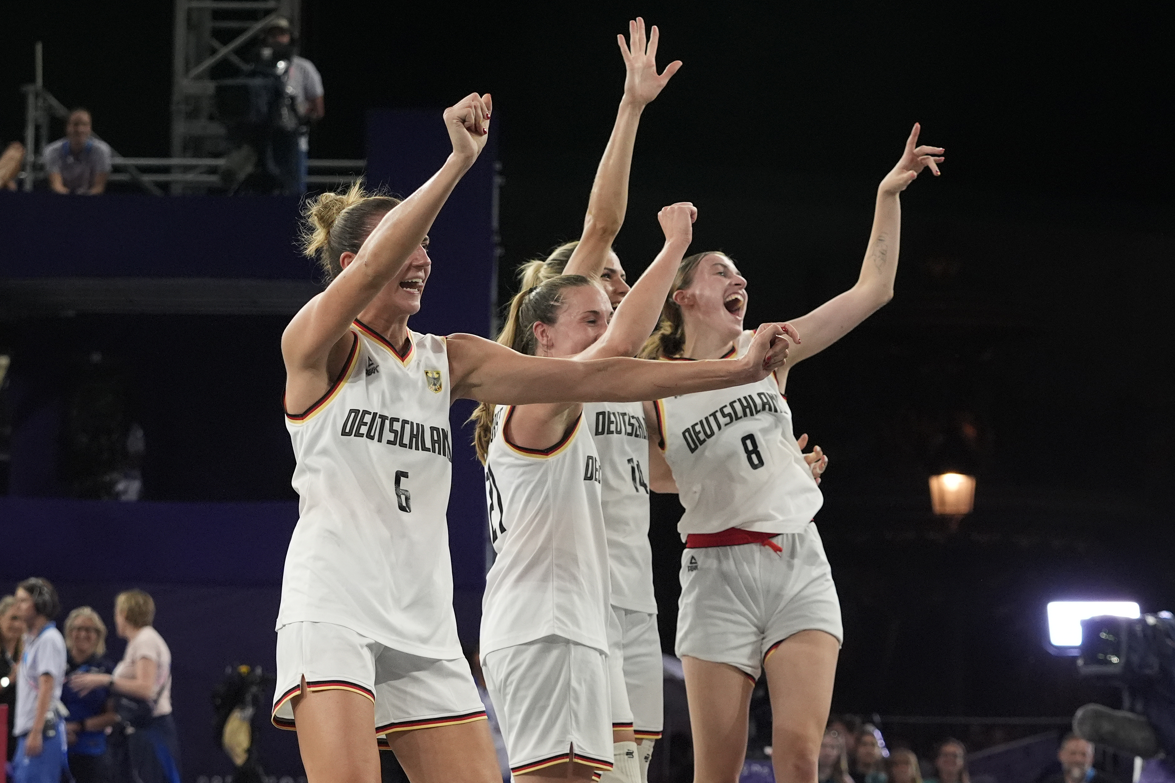 From left; Germany's Marie Reichert, Svenja Brunckhorst, Sonja Greinacher and Elisa Mevius celebrate after a women's 3x3 basketball gold medal game against Spain at the 2024 Summer Olympics, Monday, Aug. 5, 2024, in Paris, France. 