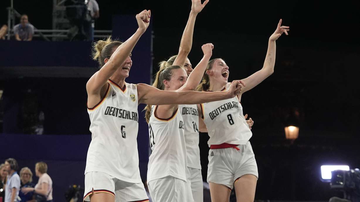 From left; Germany's Marie Reichert, Svenja Brunckhorst, Sonja Greinacher and Elisa Mevius celebrate after a women's 3x3 basketball gold medal game against Spain at the 2024 Summer Olympics, Monday, Aug. 5, 2024, in Paris, France.