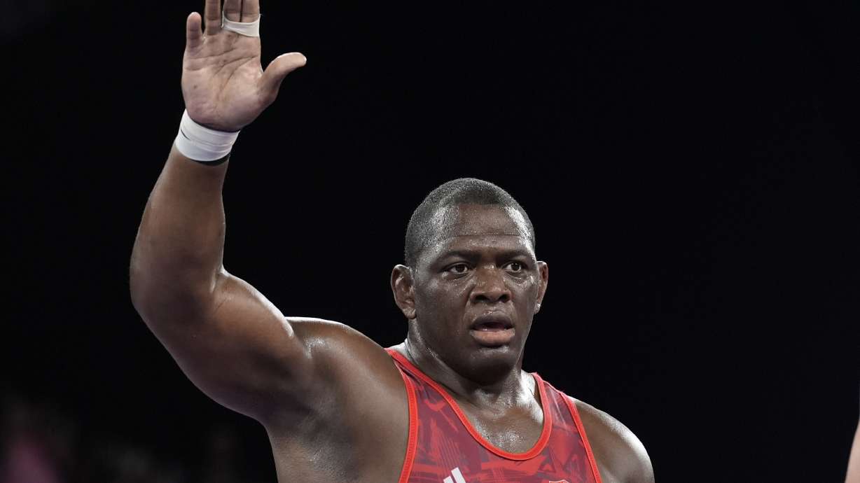 Cuba's Mijain Lopez celebrates after defeating Azerbaijan's Sabah Shariati during their men's Greco-Roman 130kg wrestling semifinal match, at Champ-de-Mars Arena, during the 2024 Summer Olympics, Monday, Aug. 5, 2024, in Paris, France.