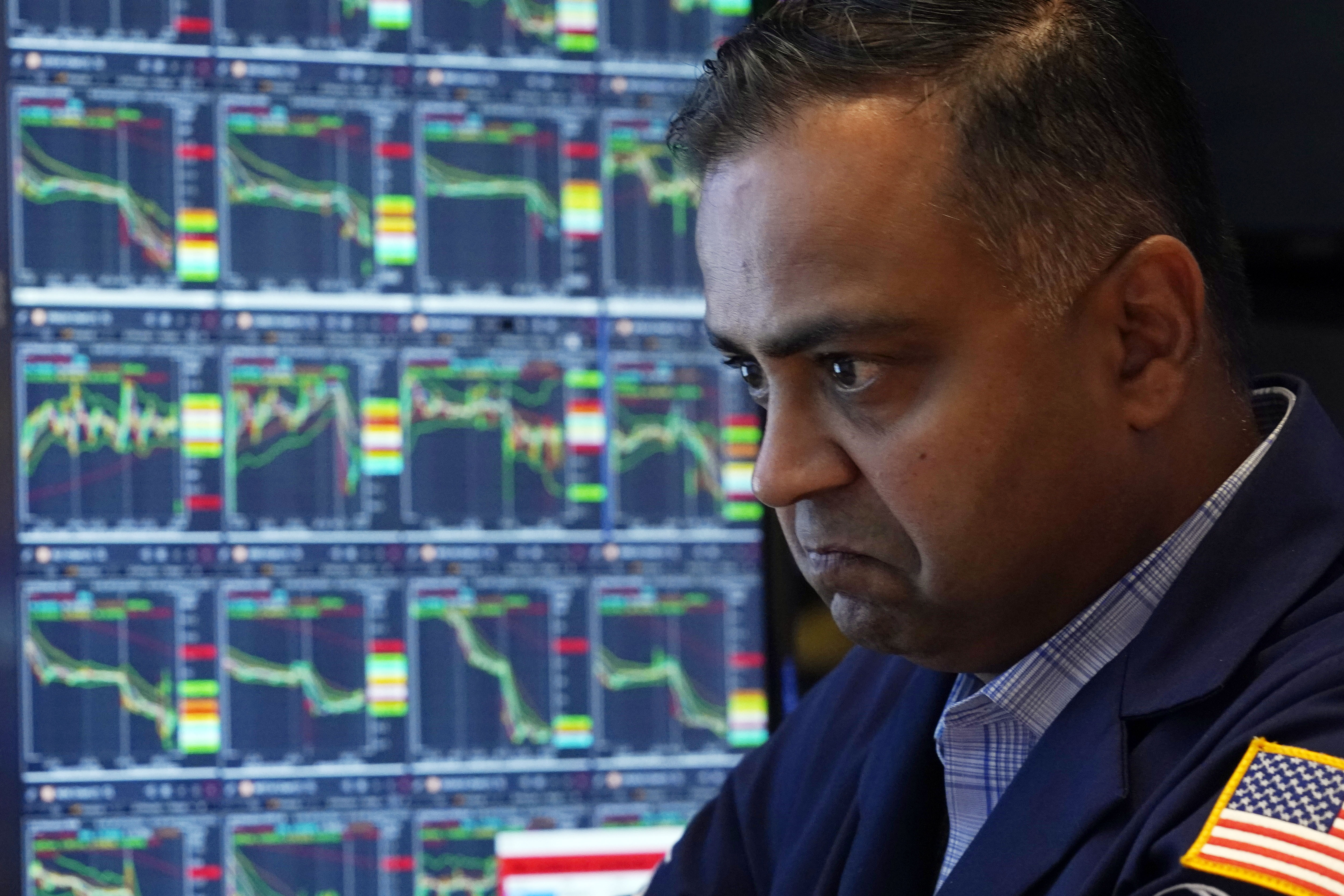 Specialist Dilip Patel works at his post on the floor of the New York Stock Exchange, Monday. U.S. stocks are bouncing back Tuesday following its worst day in nearly 2 years.
