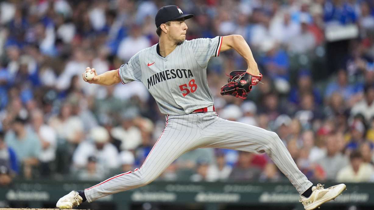 Minnesota Twins starting pitcher David Festa throws against the Chicago Cubs during the first inning of a baseball game, Monday, Aug. 5, 2024, in Chicago.