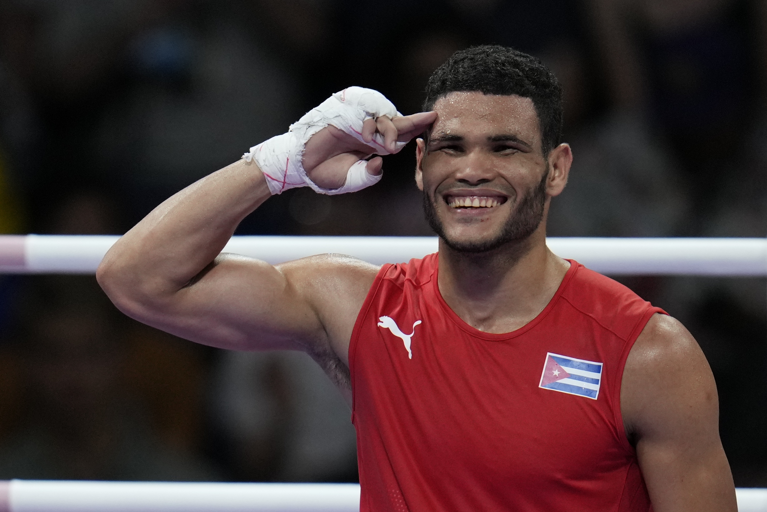 Cuba's Erislandy Alvarez, celebrates after defeating Thailand's Bunjong Sinsiri in their men's 63.5kg quarterfinal boxing match at the 2024 Summer Olympics, Thursday, Aug. 1, 2024, in Paris, France. 