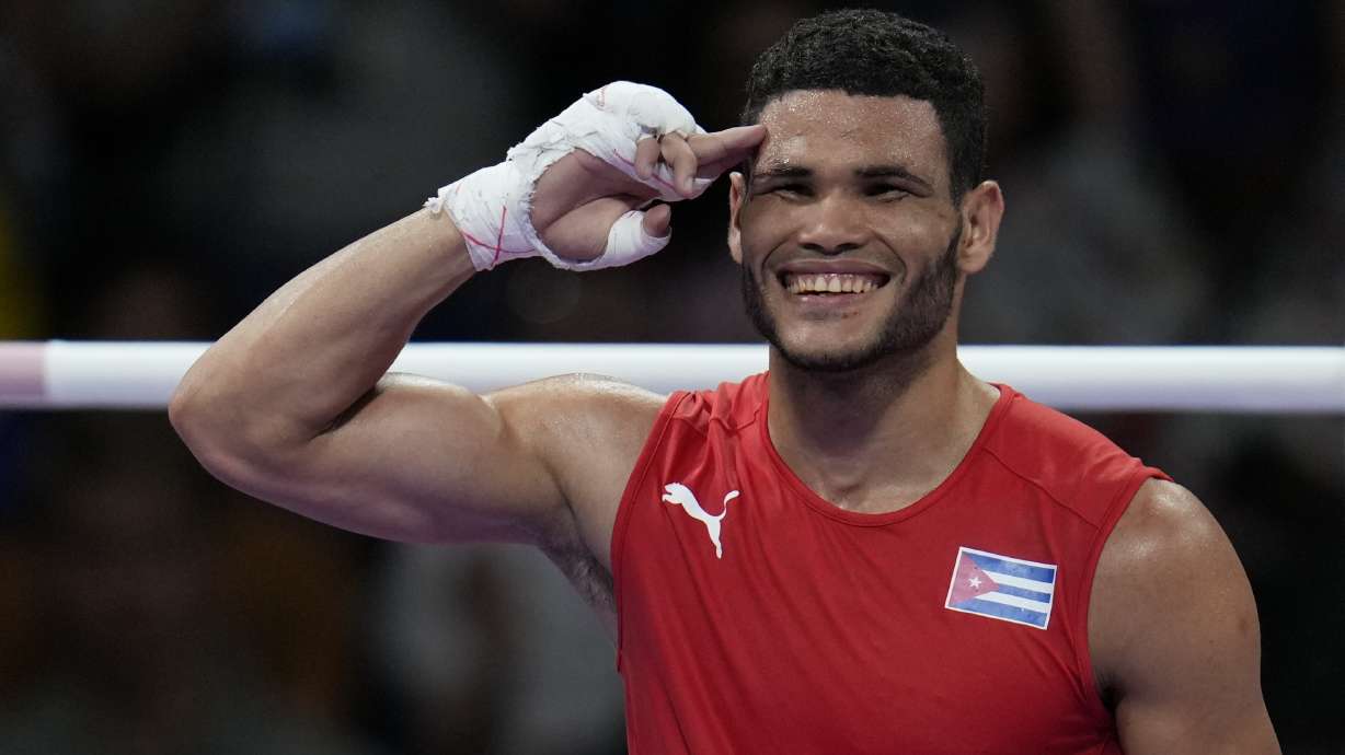 Cuba's Erislandy Alvarez, celebrates after defeating Thailand's Bunjong Sinsiri in their men's 63.5kg quarterfinal boxing match at the 2024 Summer Olympics, Thursday, Aug. 1, 2024, in Paris, France.