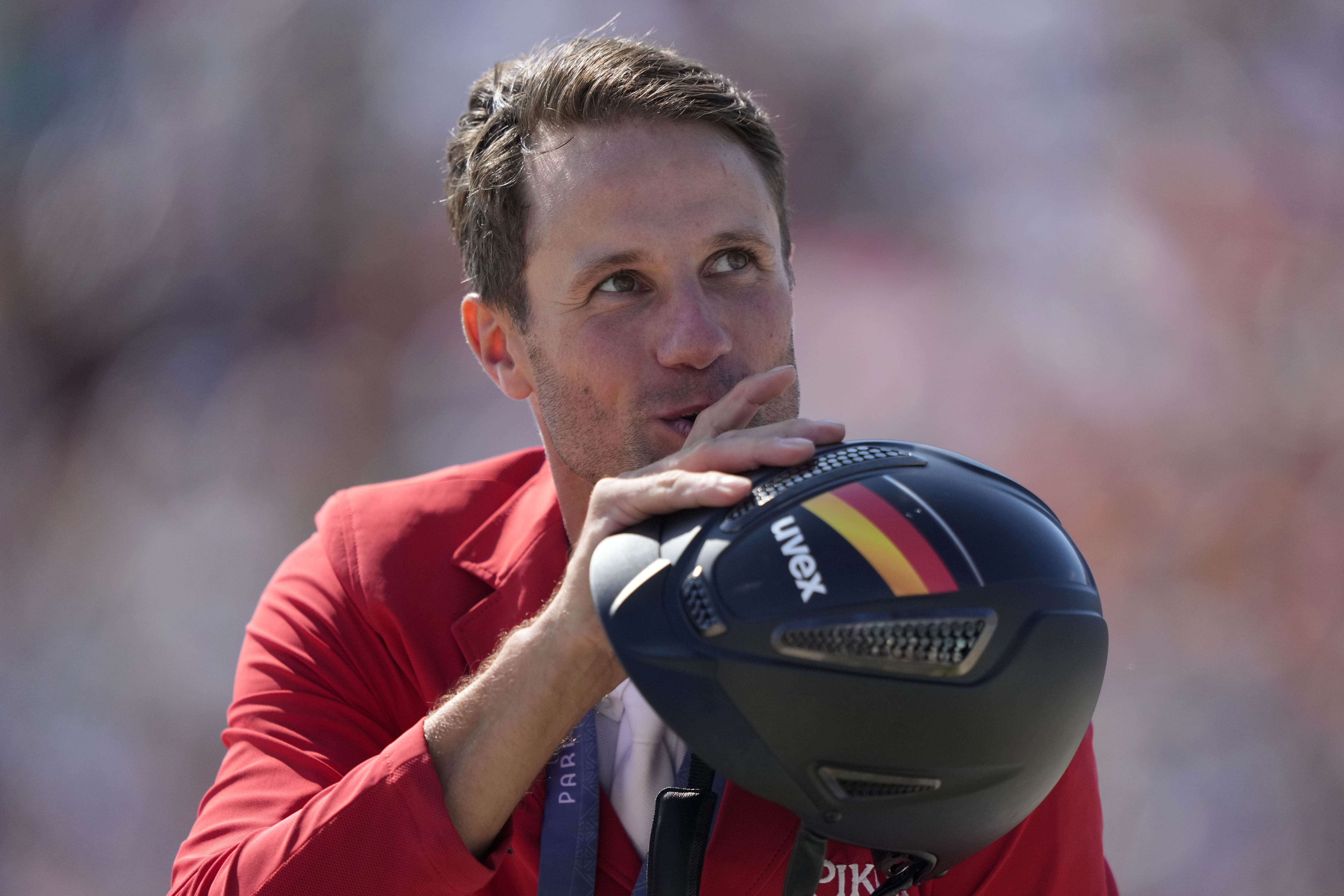 Germany's Christian Kukuk wearing his gold medal rides Checker 47 after the Jumping Individual final at the 2024 Summer Olympics, Tuesday, Aug. 6, 2024, in Versailles, France. 