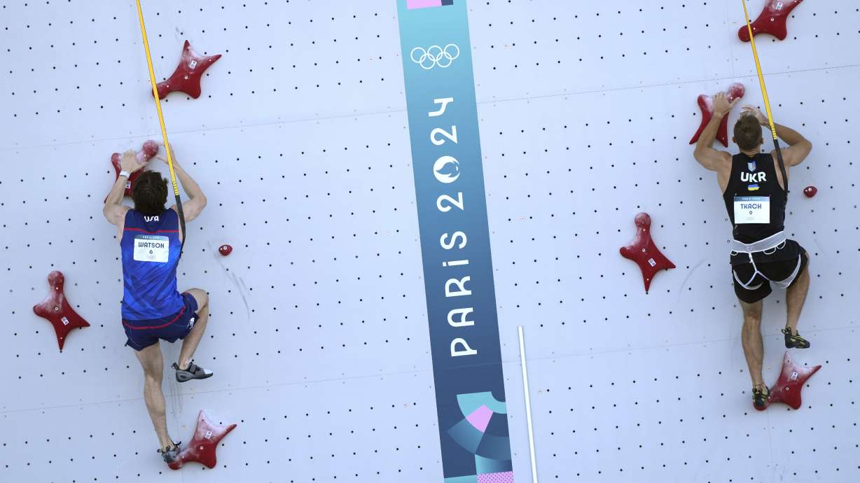 Sam Watson of the United States, left, and Yaroslav Tkach of Ukraine compete in the men's speed, qualification seeding, during the sport climbing competition at the 2024 Summer Olympics, Tuesday, Aug. 6, 2024, in Le Bourget, France.