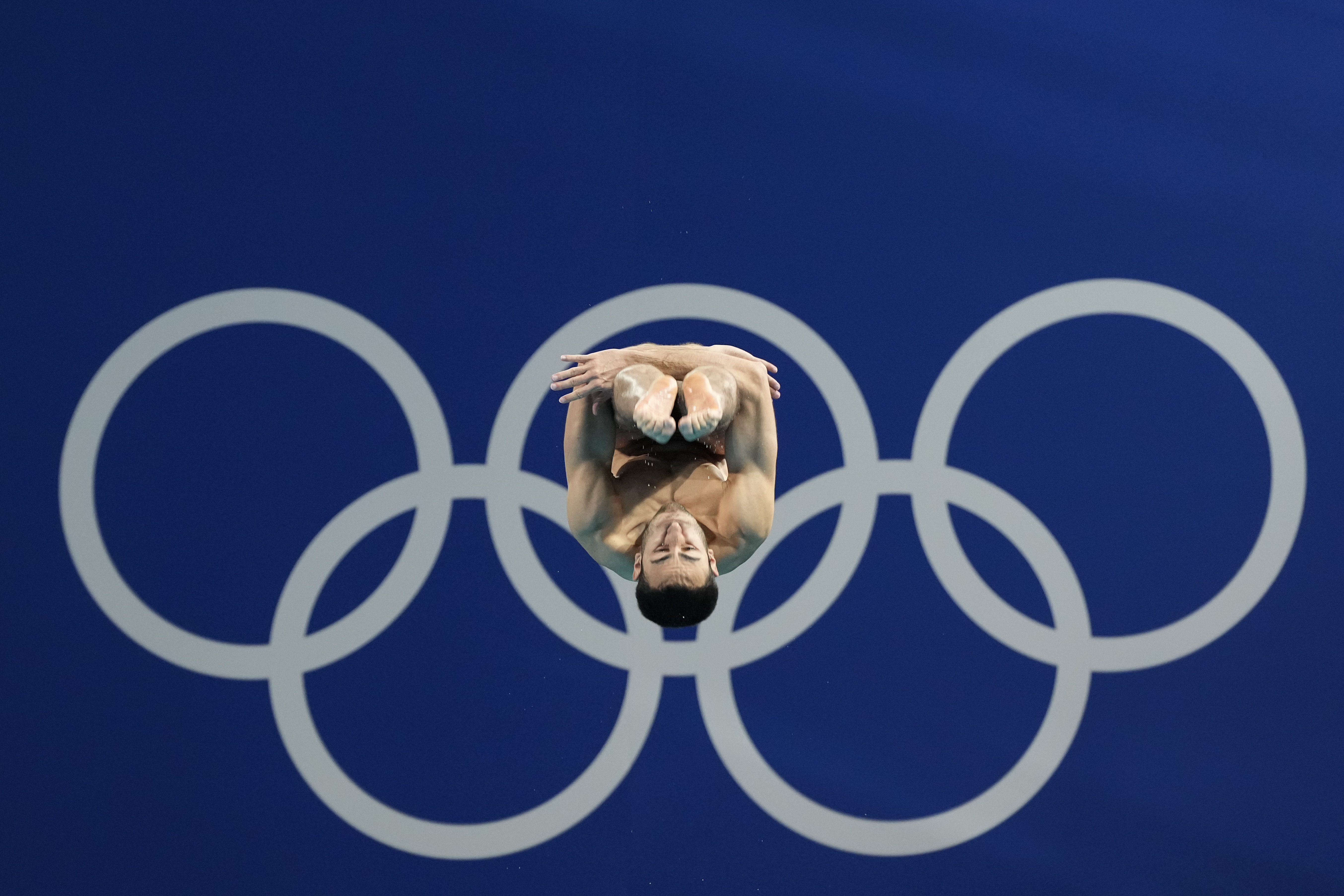 Italy's Giovanni Tocci competes in the men's 3m springboard diving preliminary at the 2024 Summer Olympics, Tuesday, Aug. 6, 2024, in Saint-Denis, France. 