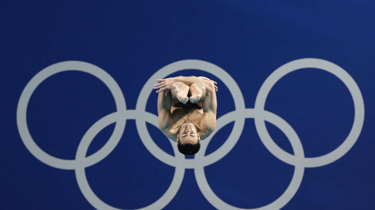 Italy's Giovanni Tocci competes in the men's 3m springboard diving preliminary at the 2024 Summer Olympics, Tuesday, Aug. 6, 2024, in Saint-Denis, France.