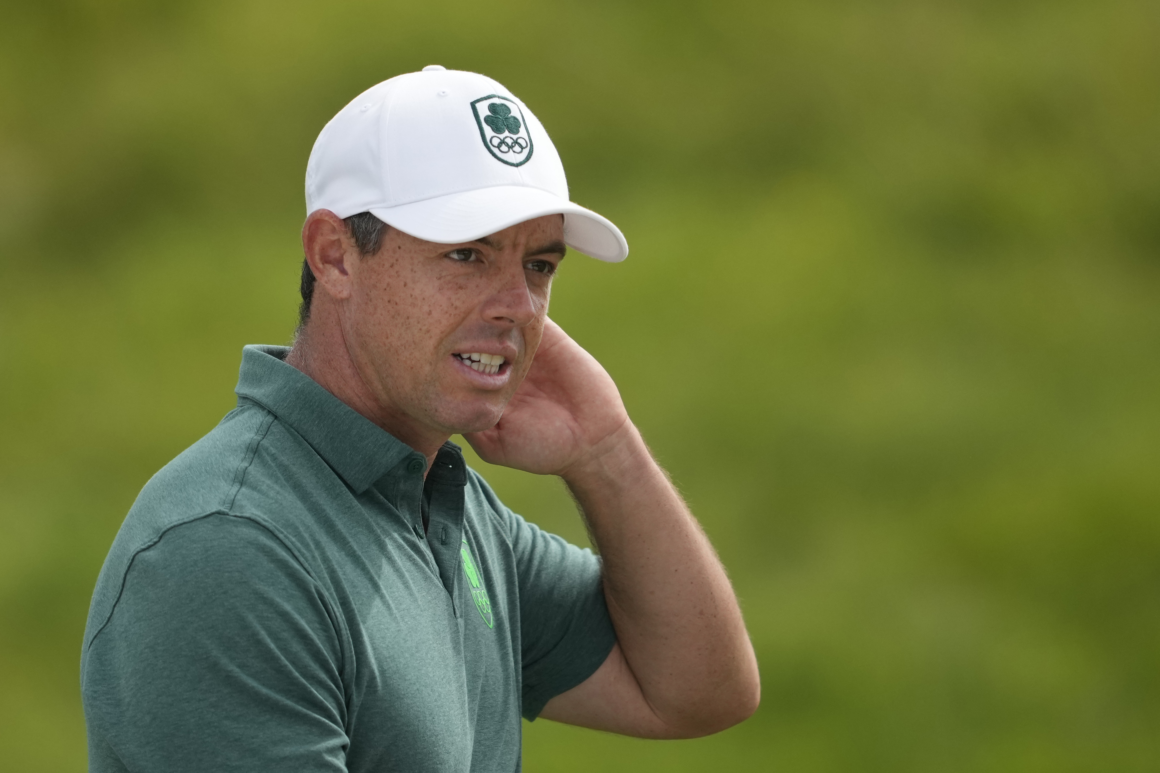 Rory McIlroy, of Ireland, reacts after putting on the 14th green during the final round of the men's golf at the 2024 Summer Olympics, Sunday, Aug. 4, 2024, at Le Golf National in Saint-Quentin-en-Yvelines, France. 