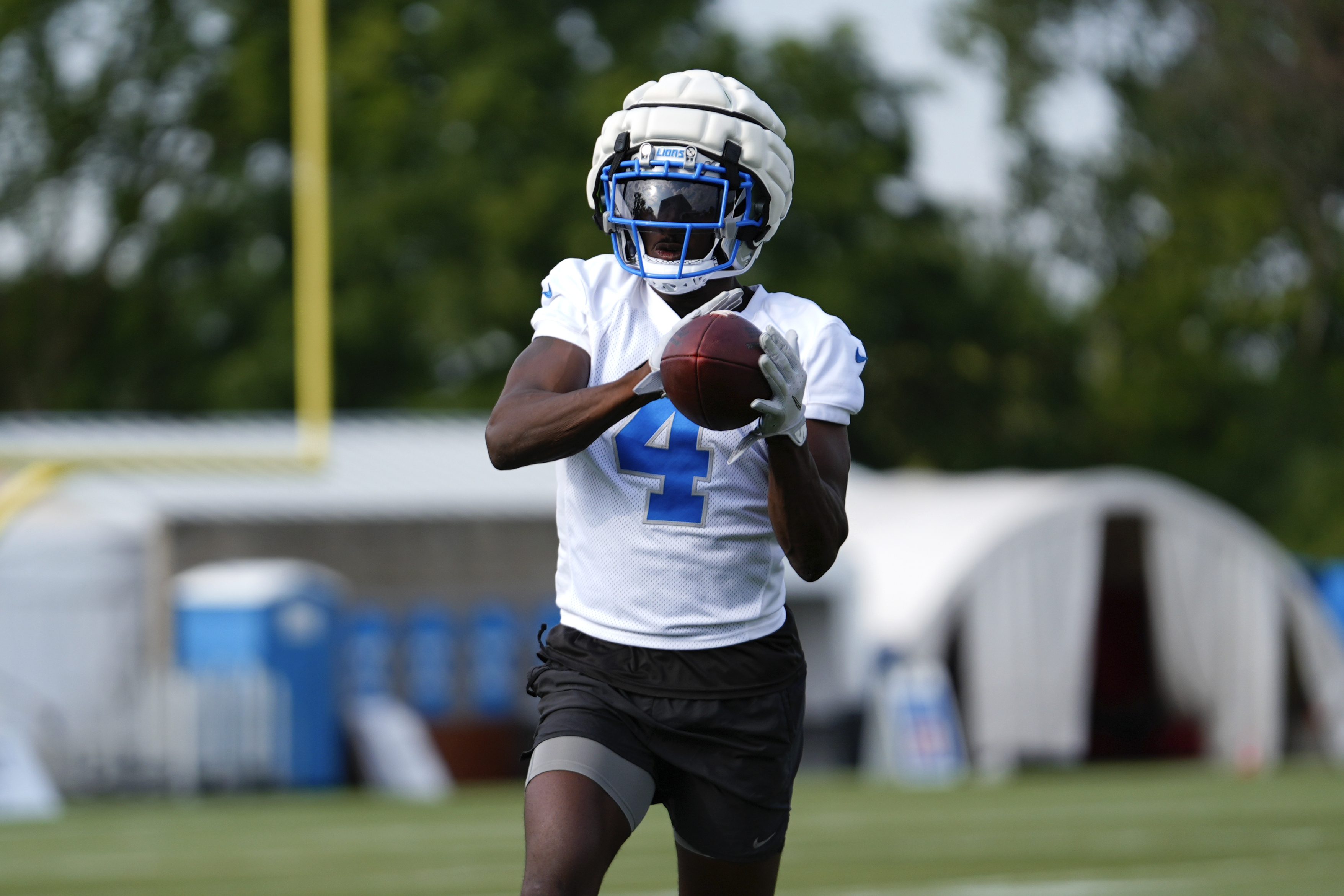 Detroit Lions cornerback Emmanuel Moseley catches a ball during an NFL football practice in Allen Park, Mich., Thursday, July 25, 2024. 