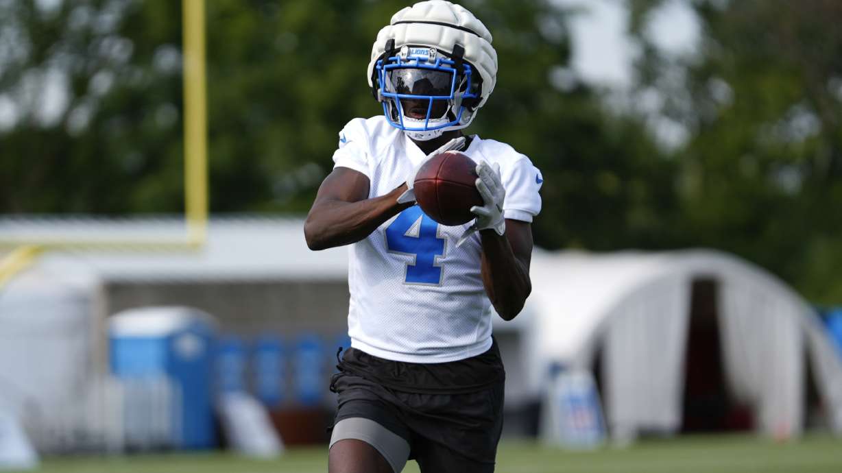 Detroit Lions cornerback Emmanuel Moseley catches a ball during an NFL football practice in Allen Park, Mich., Thursday, July 25, 2024.