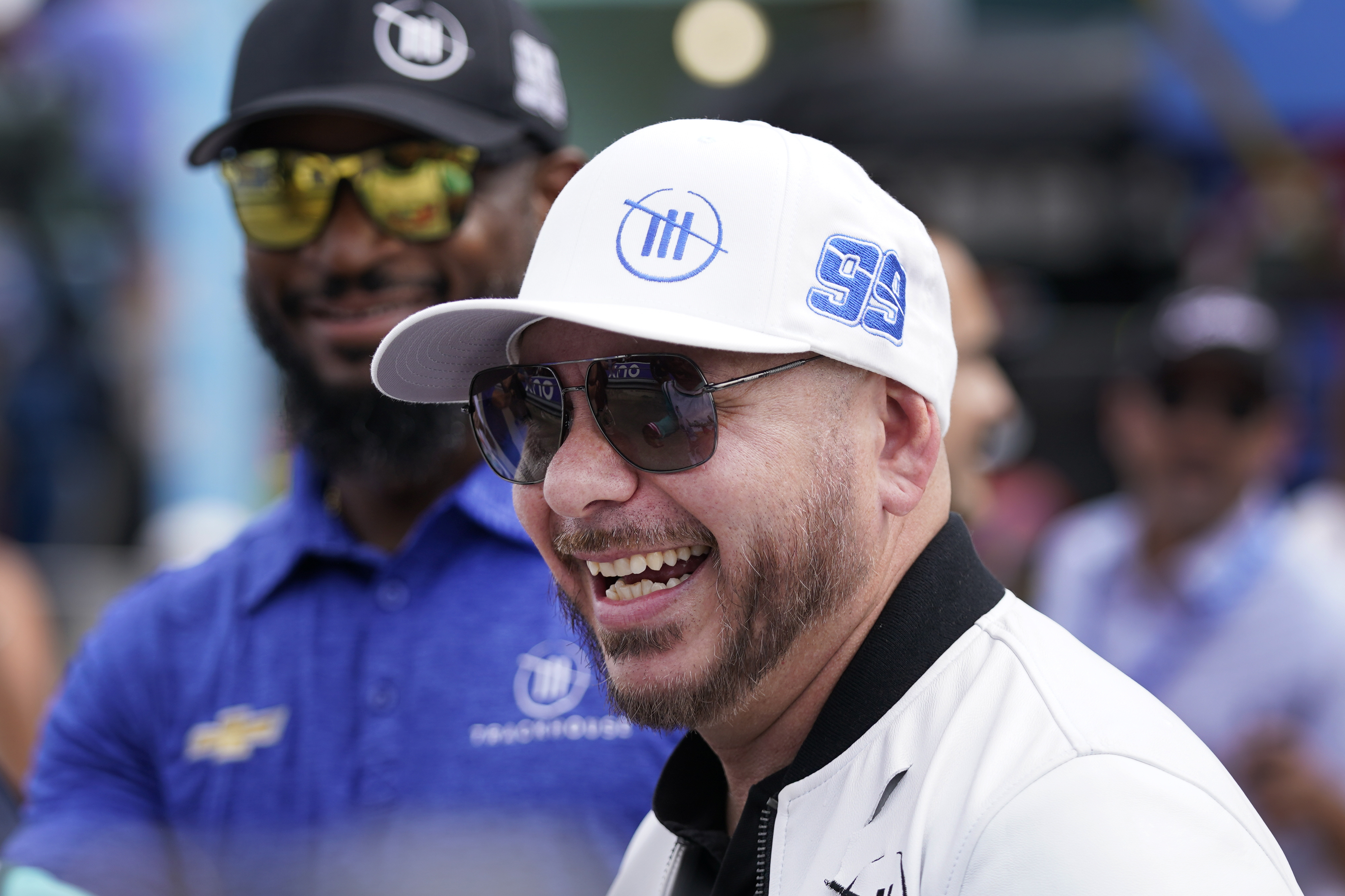 FILE - Singer, songwriter Pitbull arrives at the NASCAR Cup Series auto race at Homestead-Miami Speedway, Sunday, Oct. 22, 2023, in Homestead, Fla. 