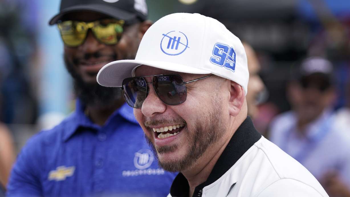 FILE - Singer, songwriter Pitbull arrives at the NASCAR Cup Series auto race at Homestead-Miami Speedway, Sunday, Oct. 22, 2023, in Homestead, Fla.