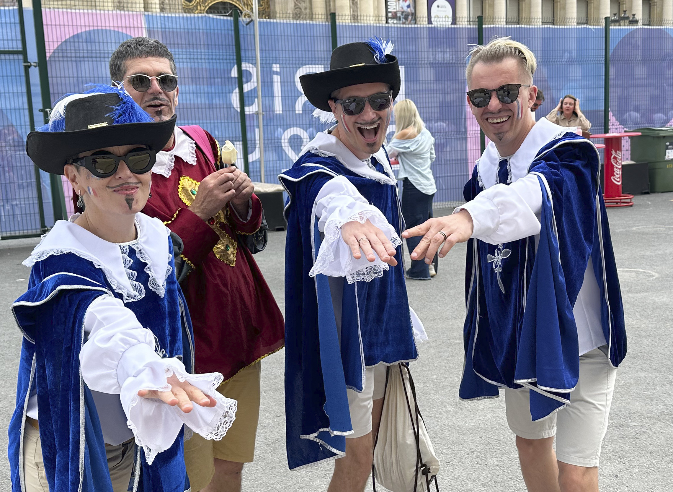 From left, Parisians Mathilde Joannard and Franck Tallieu pose with friends Jakub Mroz and Pawel Czechowicz while taking a break during the fencing competition at the 2024 Summer Olympics at the Grand Palais in Paris, France, Saturday, Aug. 3, 2024. 
