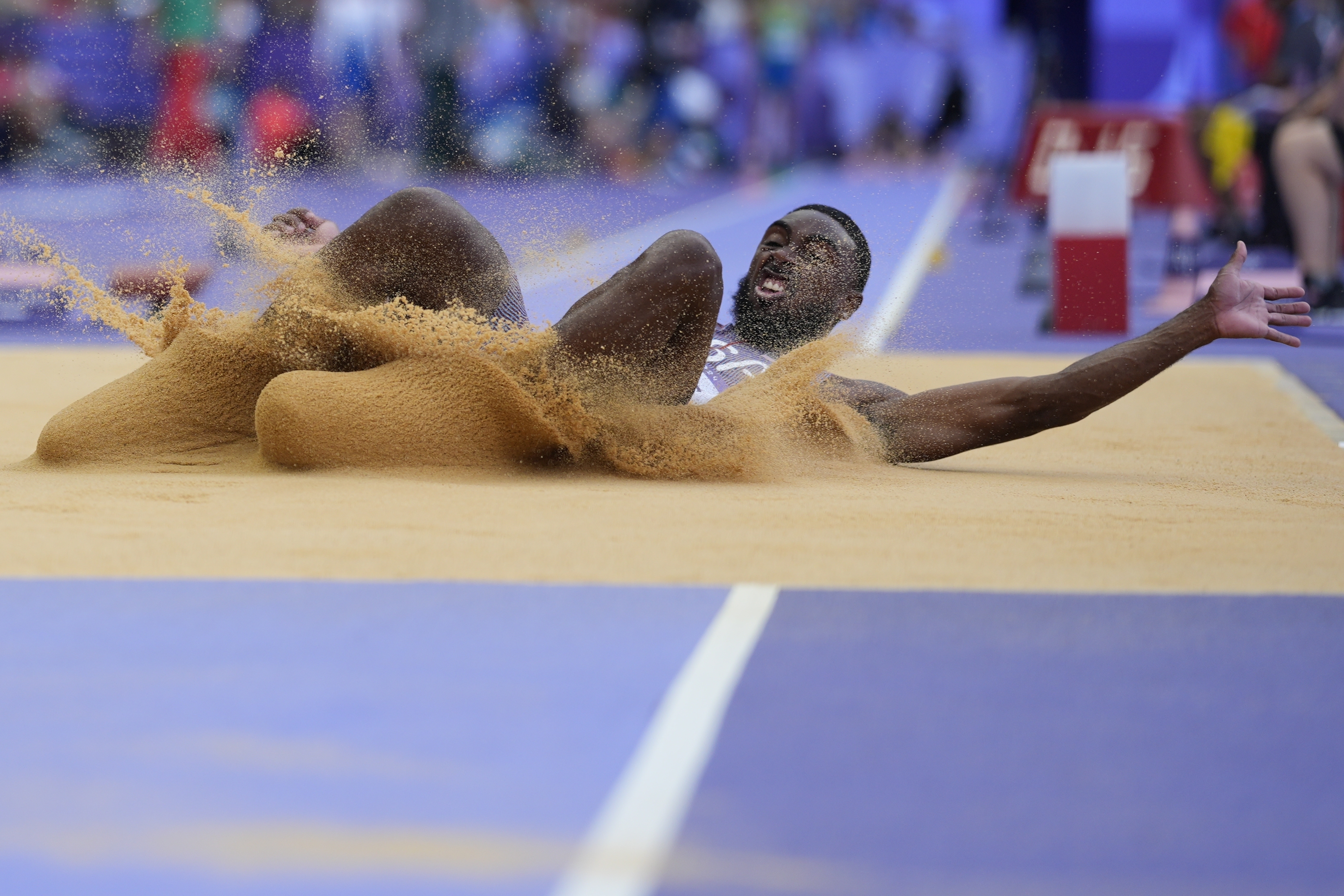Jeremiah Davis, of the United States, competes in the men's long jump qualification at the 2024 Summer Olympics, Sunday, Aug. 4, 2024, in Saint-Denis, France. 