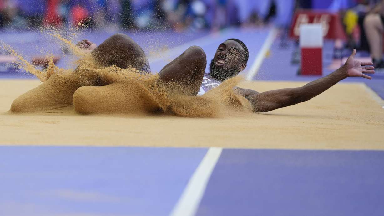 Jeremiah Davis, of the United States, competes in the men's long jump qualification at the 2024 Summer Olympics, Sunday, Aug. 4, 2024, in Saint-Denis, France.