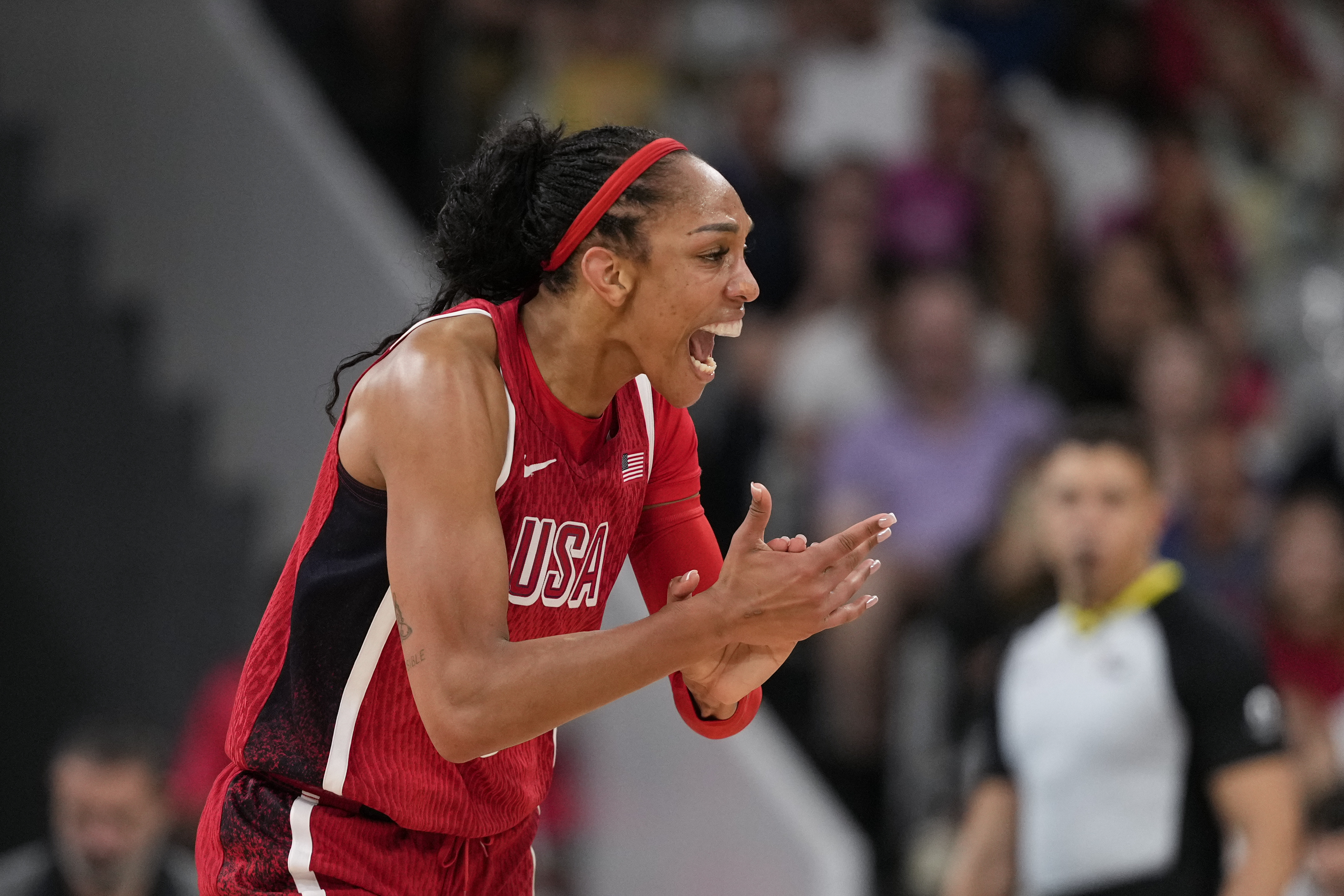 A'ja Wilson (9), of the United States, celebrates in a women's basketball game against Germany at the 2024 Summer Olympics, Sunday, Aug. 4, 2024, in Villeneuve-d'Ascq, France. 