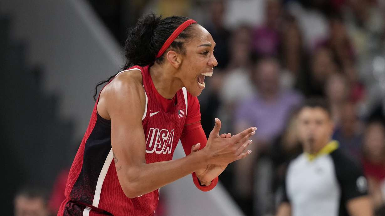A'ja Wilson (9), of the United States, celebrates in a women's basketball game against Germany at the 2024 Summer Olympics, Sunday, Aug. 4, 2024, in Villeneuve-d'Ascq, France.