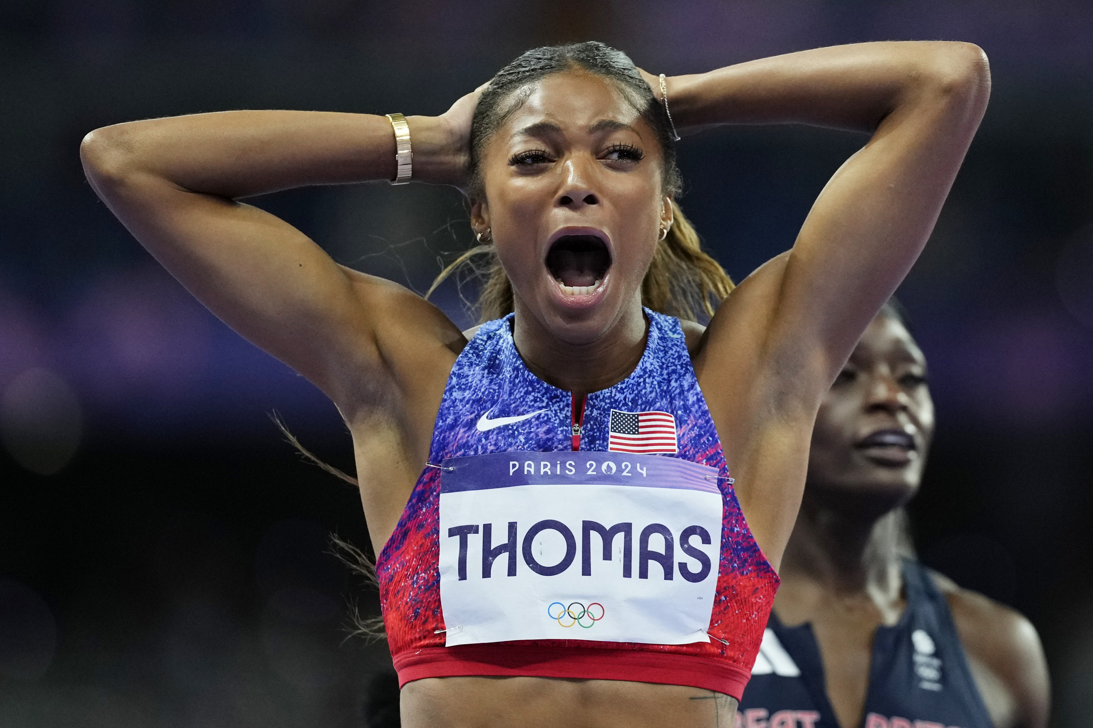 Gabrielle Thomas, of the United States, reacts after winning the women's 200-meters final at the 2024 Summer Olympics, Tuesday, Aug. 6, 2024, in Saint-Denis, France. 