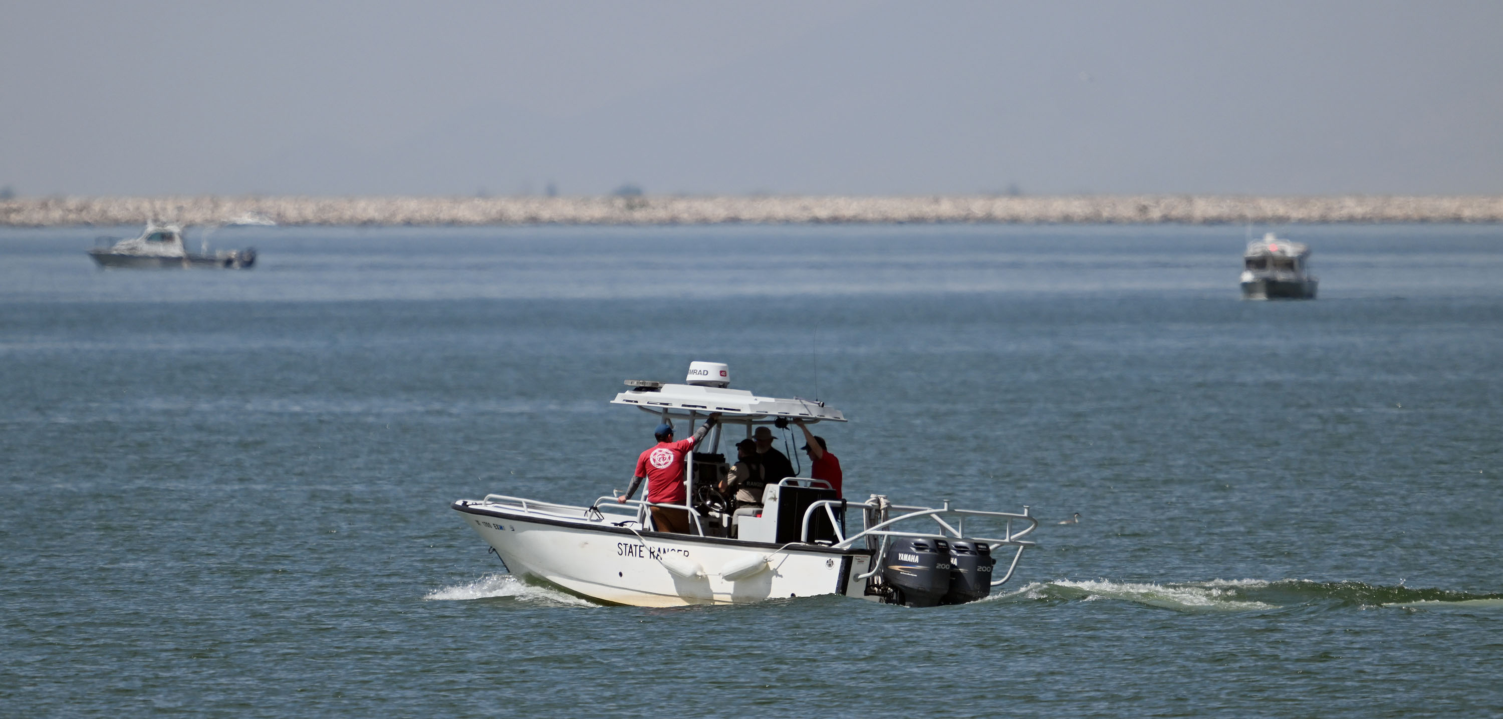 Searchers work to recover the body of Robert Mittendorf on Monday at Willard Bay. Mittendorf's body was found Tuesday. 