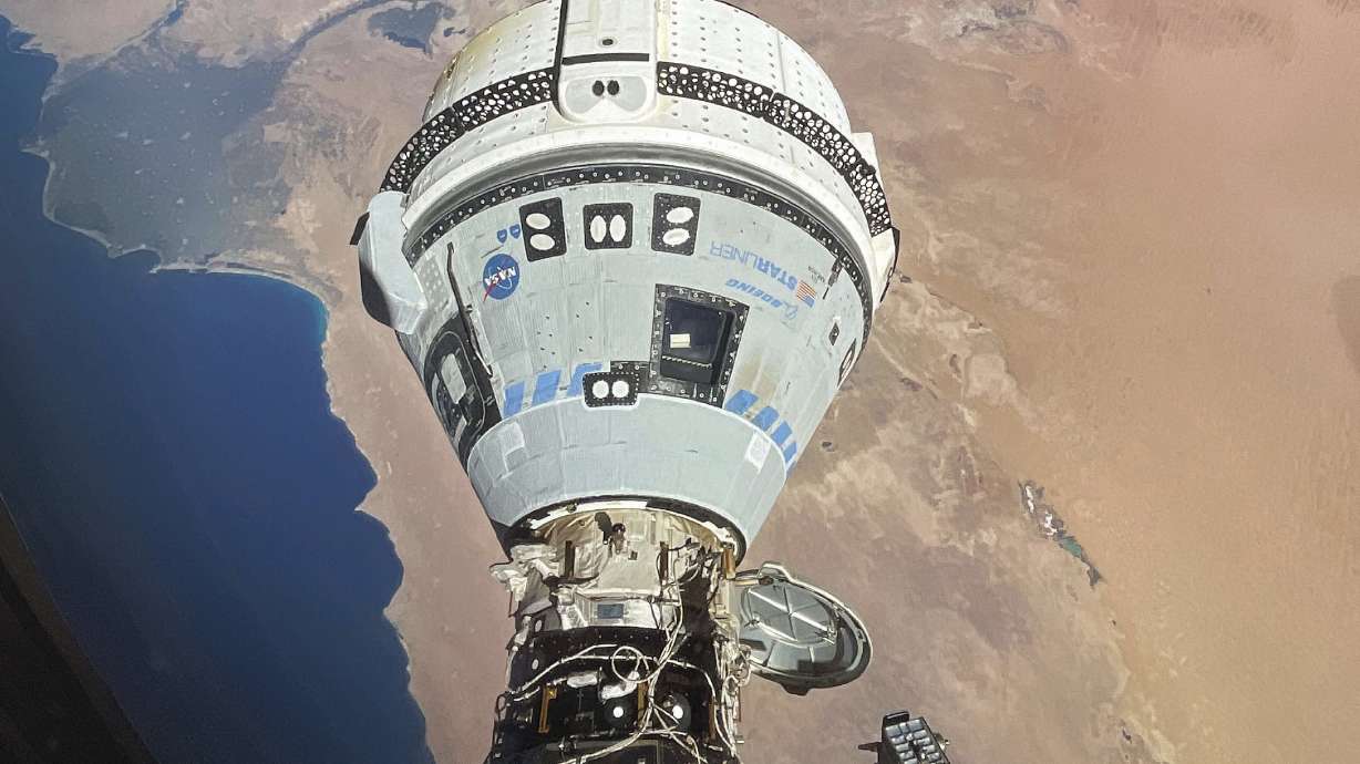 This photo provided by NASA shows the Starliner spacecraft docked to the Harmony module of the International Space Station, orbiting 262 miles above Egypt's Mediterranean coast, on June 13.