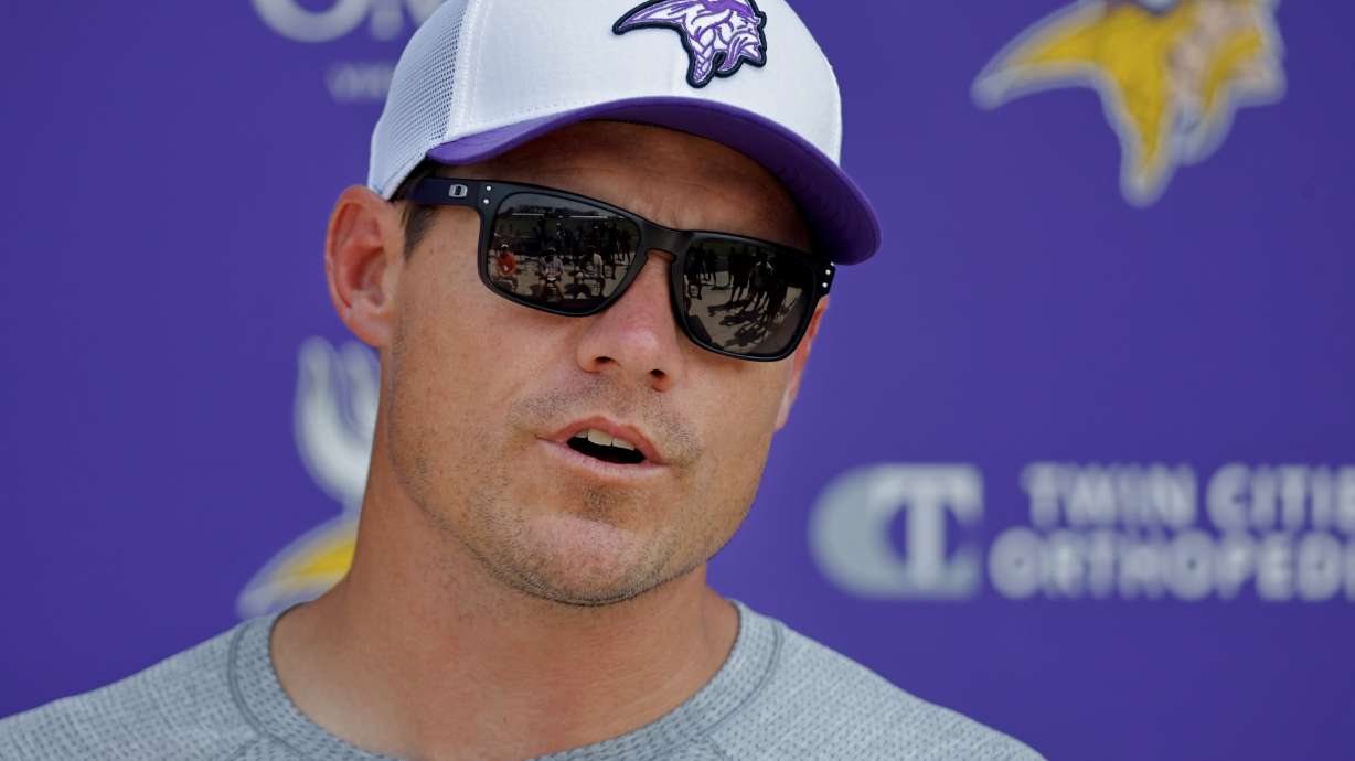 Minnesota Vikings head coach Kevin O'Connell talks with the media during NFL football training camp Saturday, July 27, 2024, in Eagan, Minn..