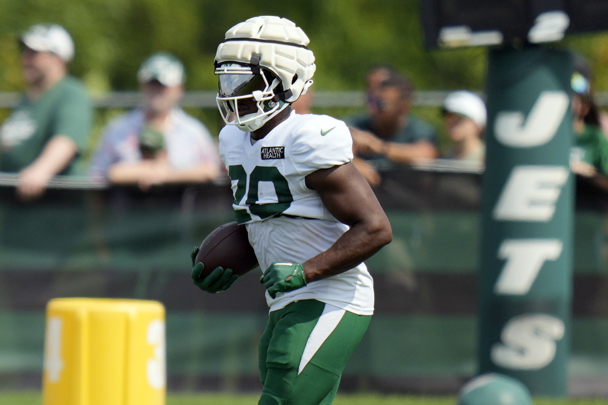 FILE - New York Jets' Breece Hall runs a drill during a practice at the NFL football team's training facility in Florham Park, N.J., Tuesday, July 30, 2024. 